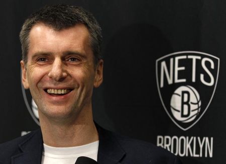Mikhail Prokhorov wants, and now has, the whole thing. (REUTERS/Adam Hunger)