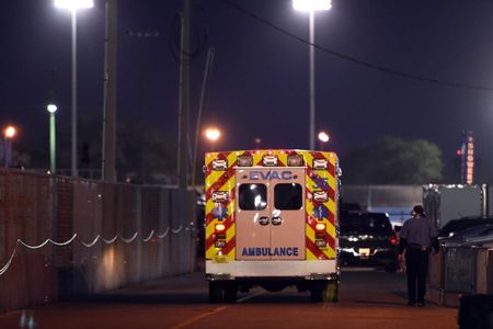 An ambulance carrying Kyle Busch  leaves the track last February.  (REUTERS)