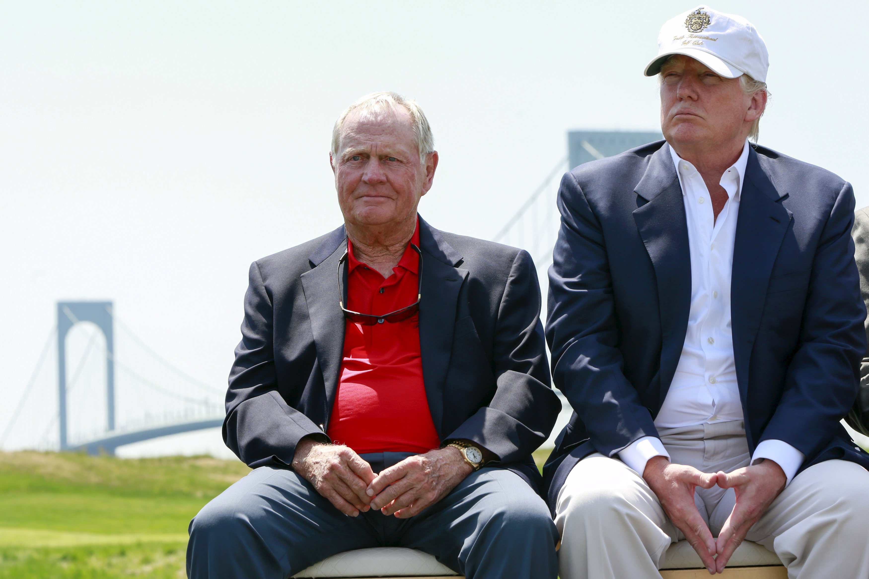 Donald Trump (R) sits with golfer Jack Nicklaus at the Trump Links at Ferry Point golf course. (REUTERS)