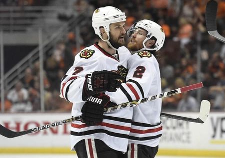 Chicago Blackhawks defenseman Brent Seabrook (7) celebrates with defenseman Duncan Keith (2) his goal scored against the Anaheim Ducks in game seven of the Western Conference Final of the 2015 Stanley Cup Playoffs at Honda Center; May 30, 2015; Anaheim, CA, USA; Gary A. Vasquez-USA TODAY Sports