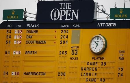 The scoreboard shows Paul Dunne of Ireland at the top. (REUTERS)