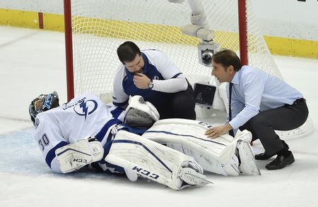 May 13, 2016; Pittsburgh, PA, USA; Medical staff attend to Tampa Bay Lightning goalie Ben Bishop (30) after being injured during the first period in game one against the Pittsburgh Penguins of the Eastern Conference Final of the 2016 Stanley Cup Playoffs at CONSOL Energy Center. Mandatory Credit: Don Wright-USA TODAY Sports