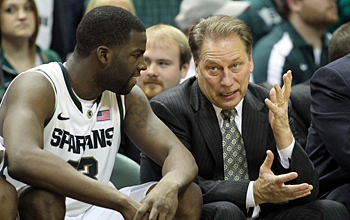 Michigan State coach Tom Izzo talks with Draymond Green on the Spartan bench.