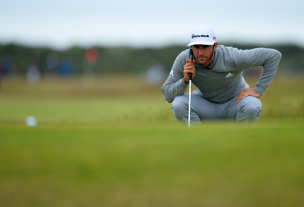 Dustin Johnson lines up his putt on the 11th green at St Andrews. (AFP)