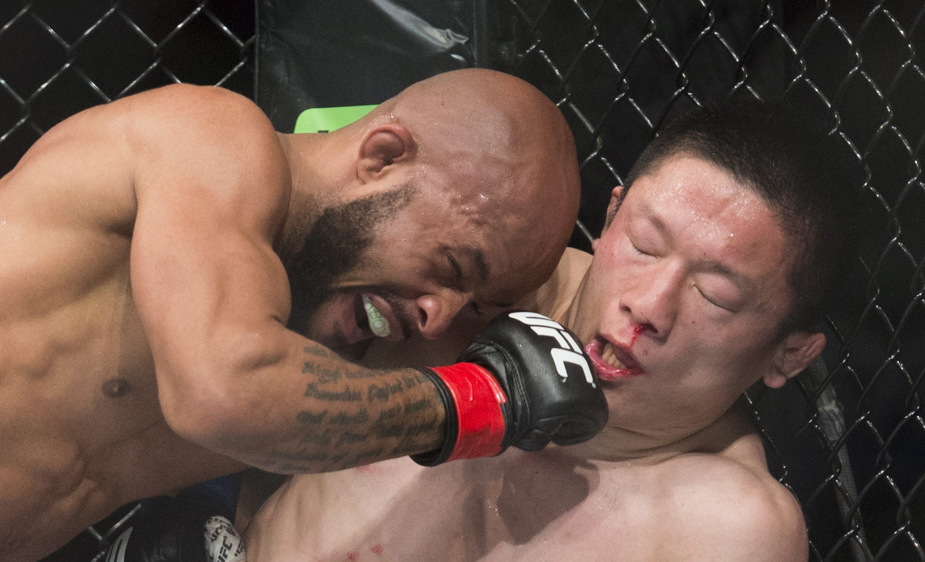 Demetrious Johnson lands a blow to the head of Kyoji Horiguchi at UFC 186. (AP)