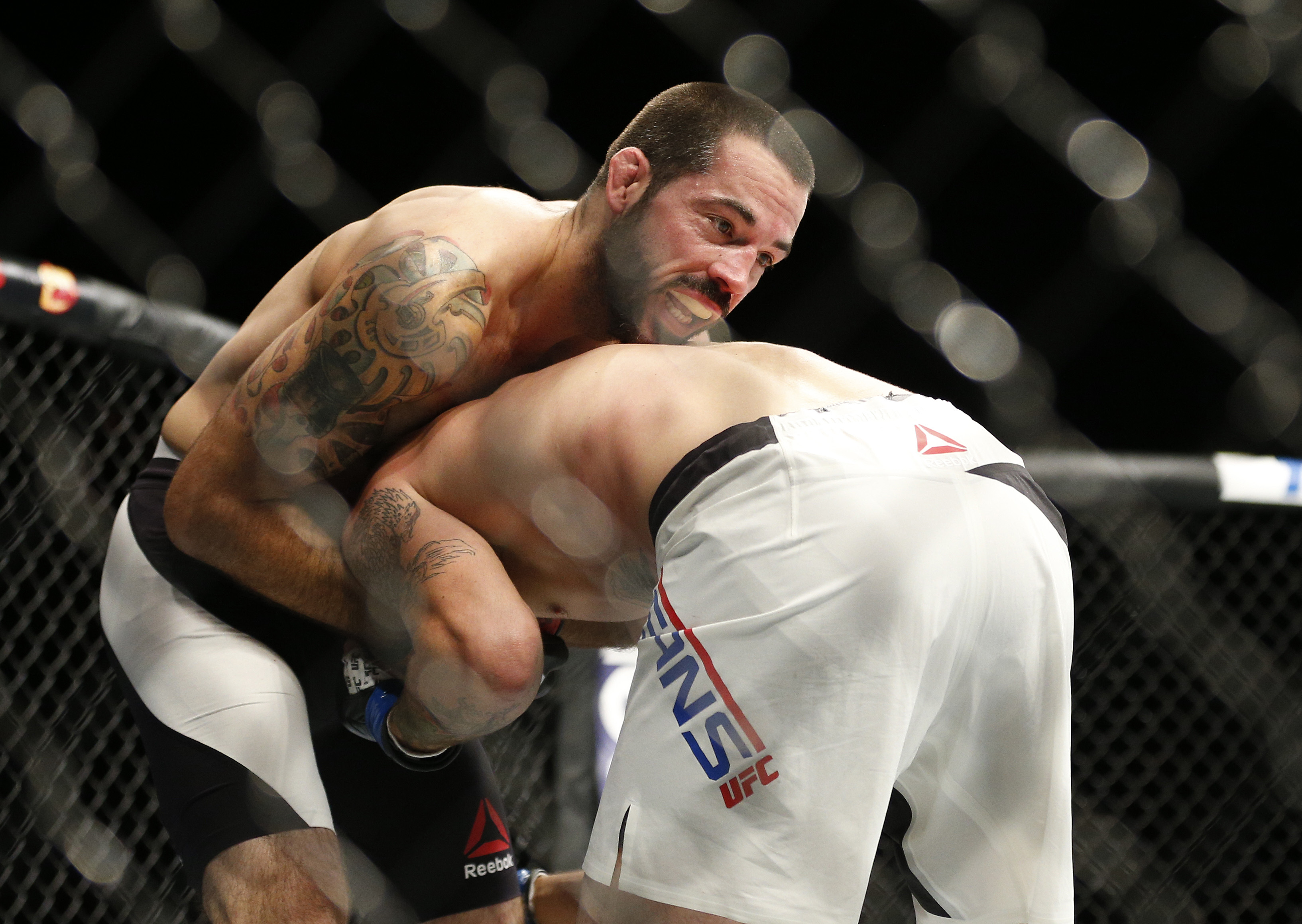 Matt Brown submitted Tim Means via guillotine choke.  (AP Photo/John Locher)