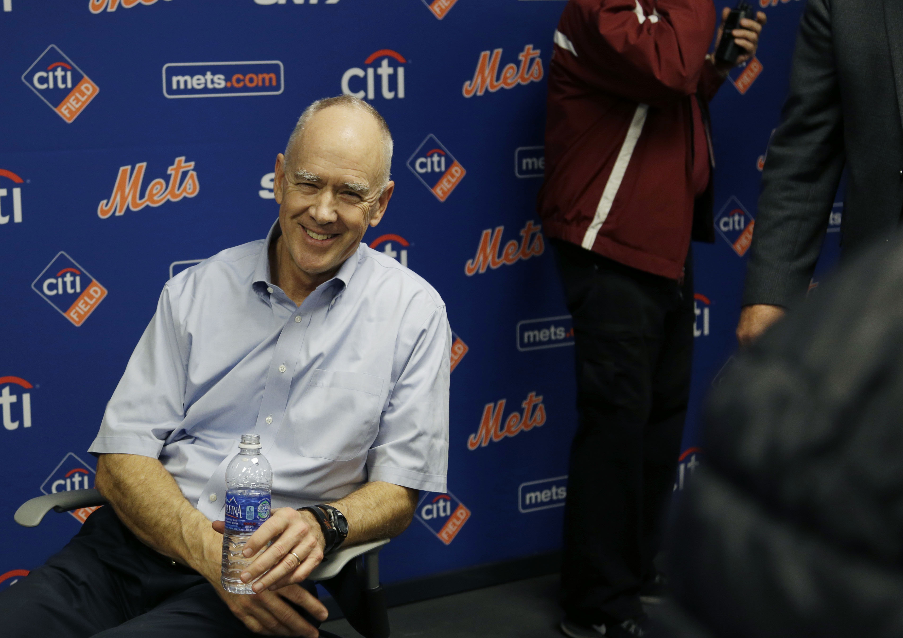 New York Mets general manger Sandy Alderson rests in a chair after collapsing during a news conference in New York, Wednesday, Nov. 4, 2015. (AP Photo/Seth Wenig)