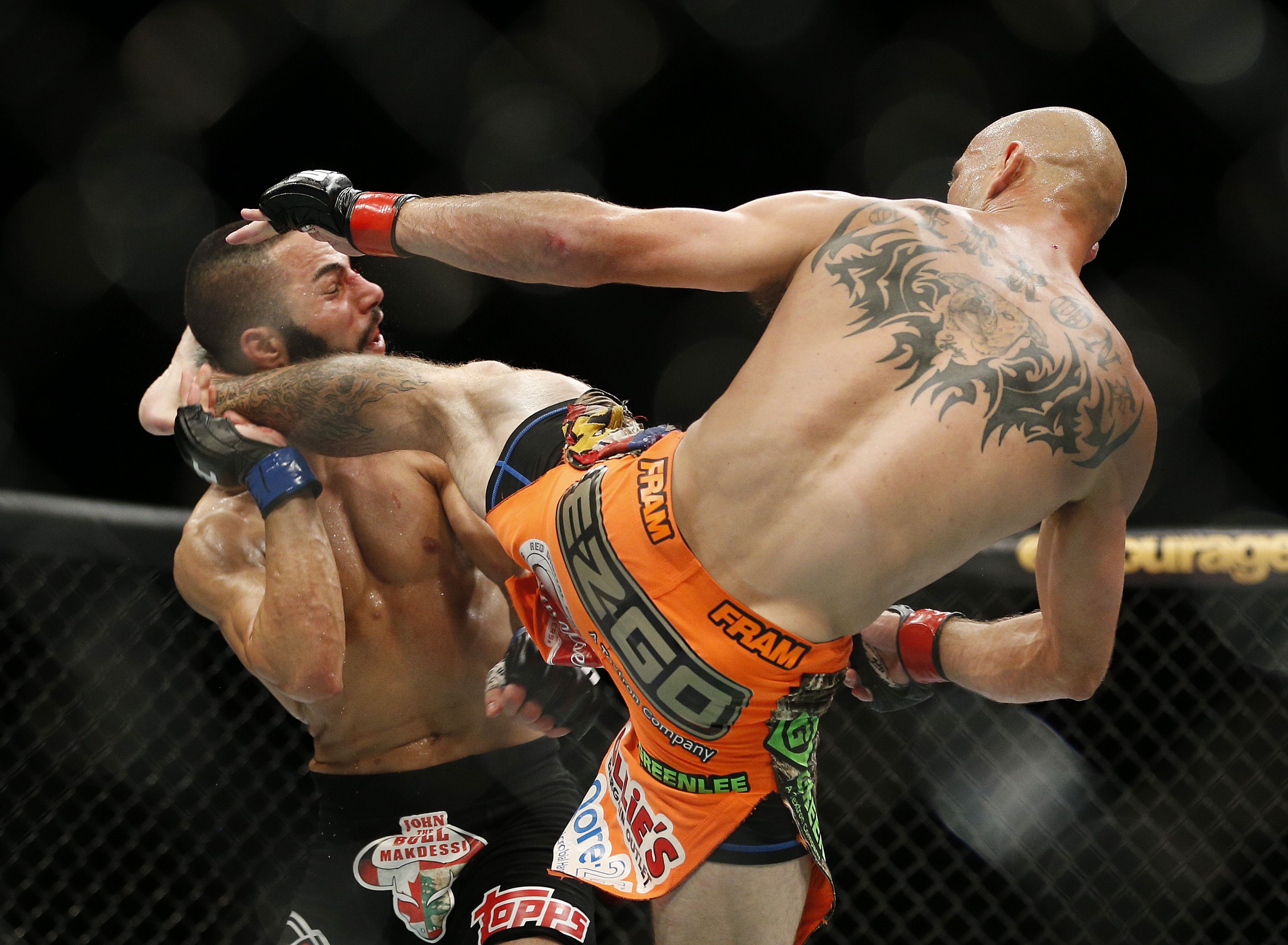 Donald Cerrone lands a kick to John Makdessi that ended their fight. (AP)