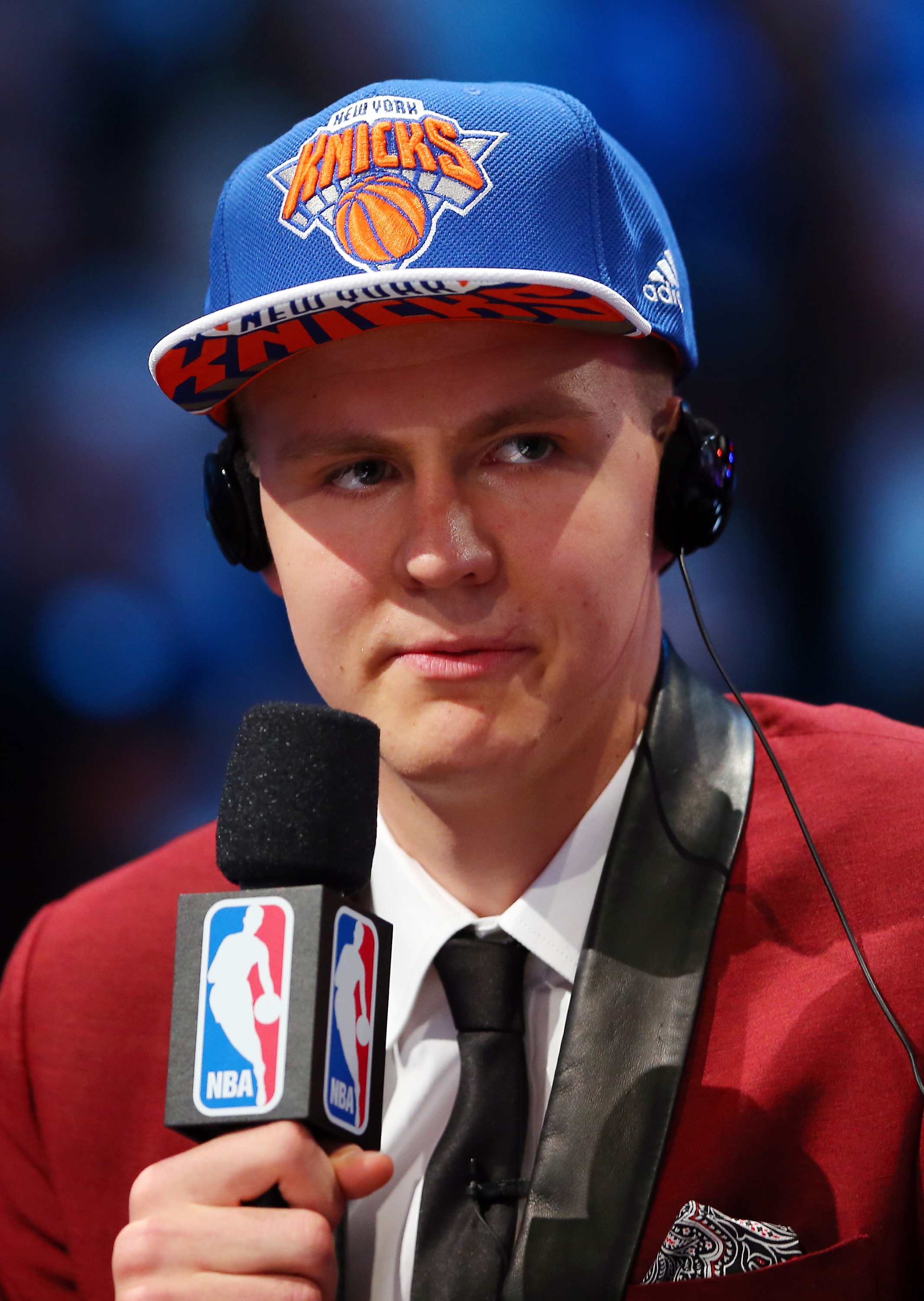 Kristaps Porzingis requests that his employers stop talking. (Elsa/Getty Images)