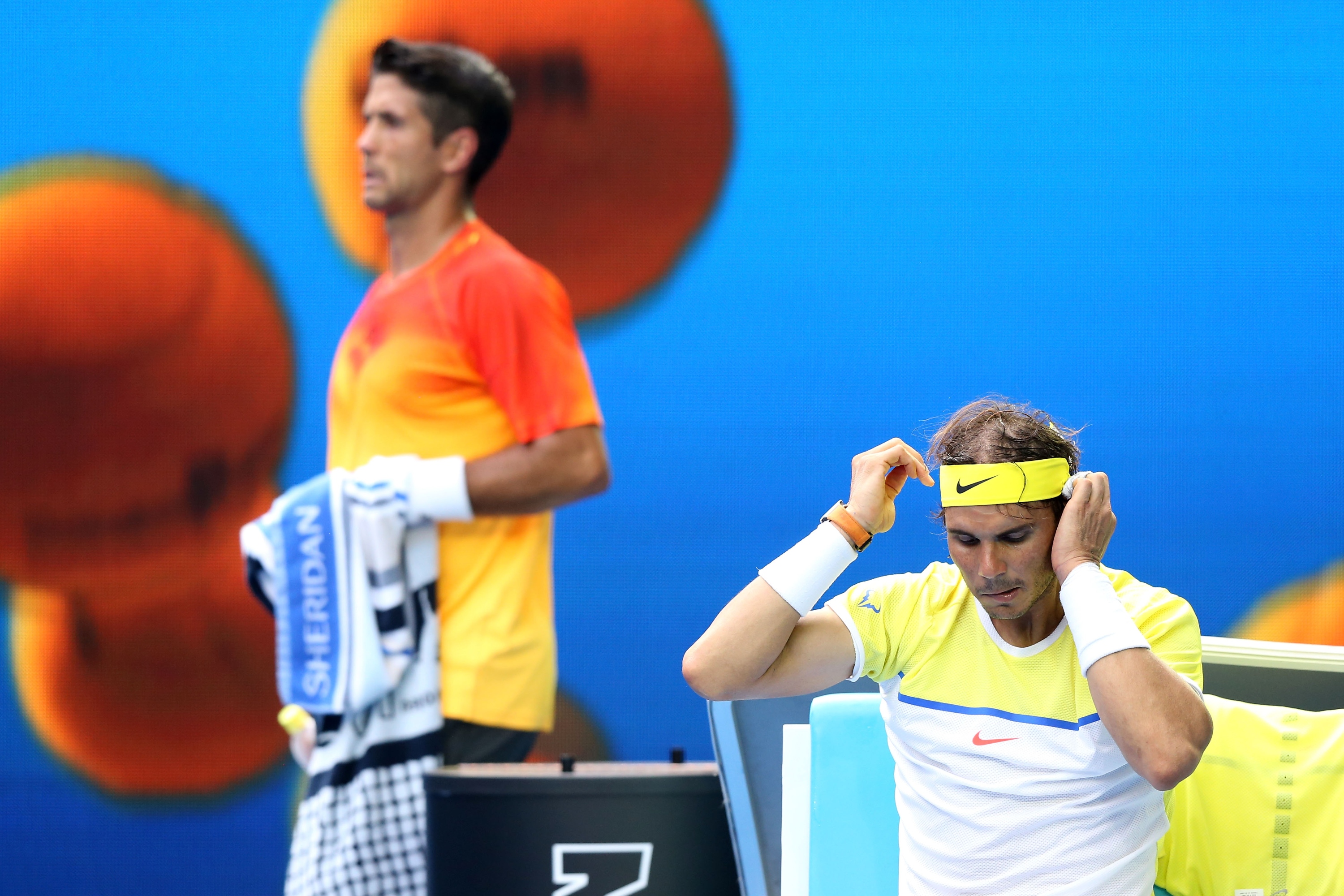 MELBOURNE, AUSTRALIA - JANUARY 19:  Fernando Verdasco of Spain walks behind Rafael Nadal of Spain in between the change of ends in their first round match during day two of the 2016 Australian Open at Melbourne Park on January 19, 2016 in Melbourne, Australia.  (Photo by Michael Dodge/Getty Images)