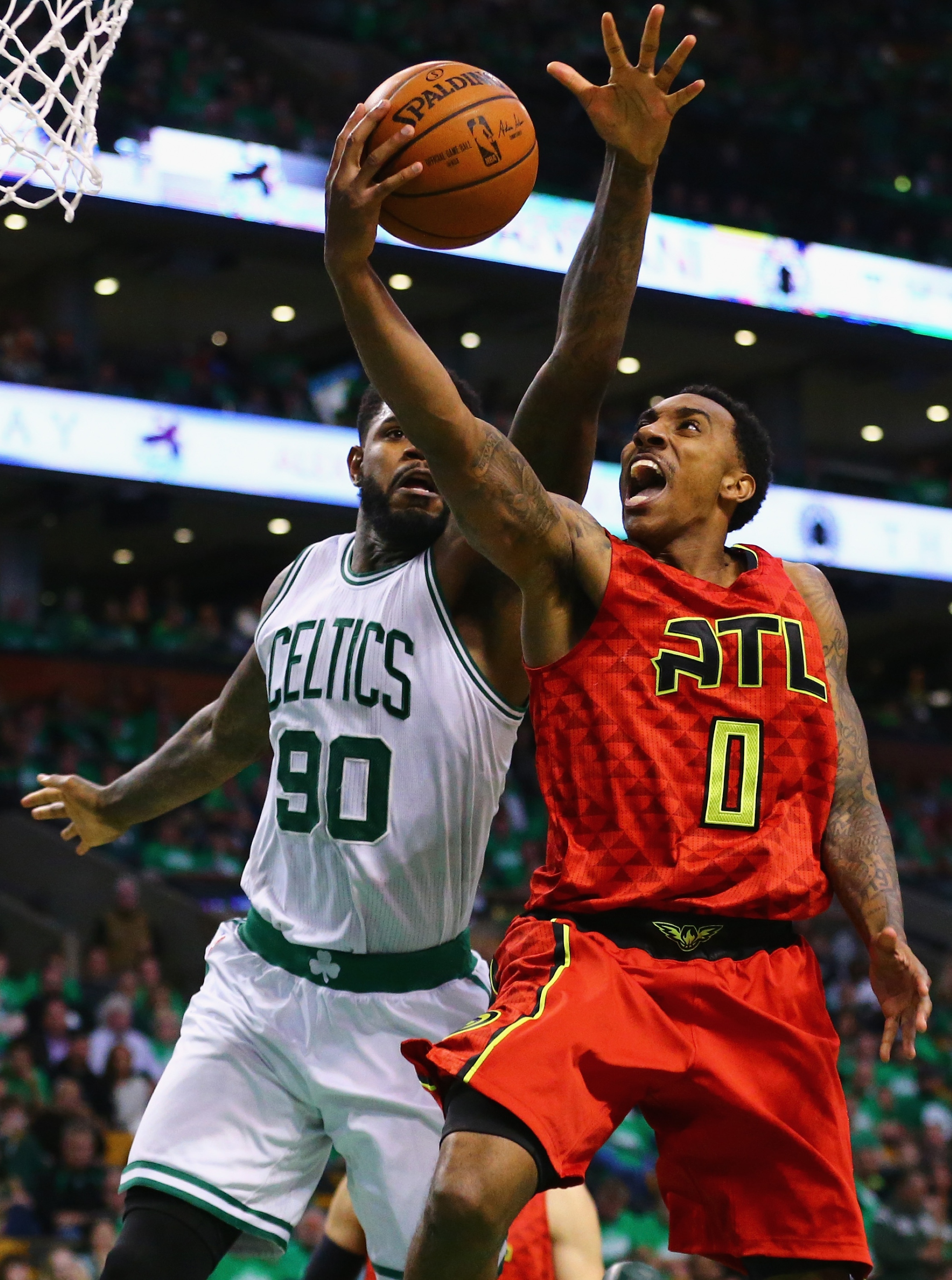 Jeff Teague attempts to score against the Celtics on an injured knee. (Maddie Meyer/Getty Images)