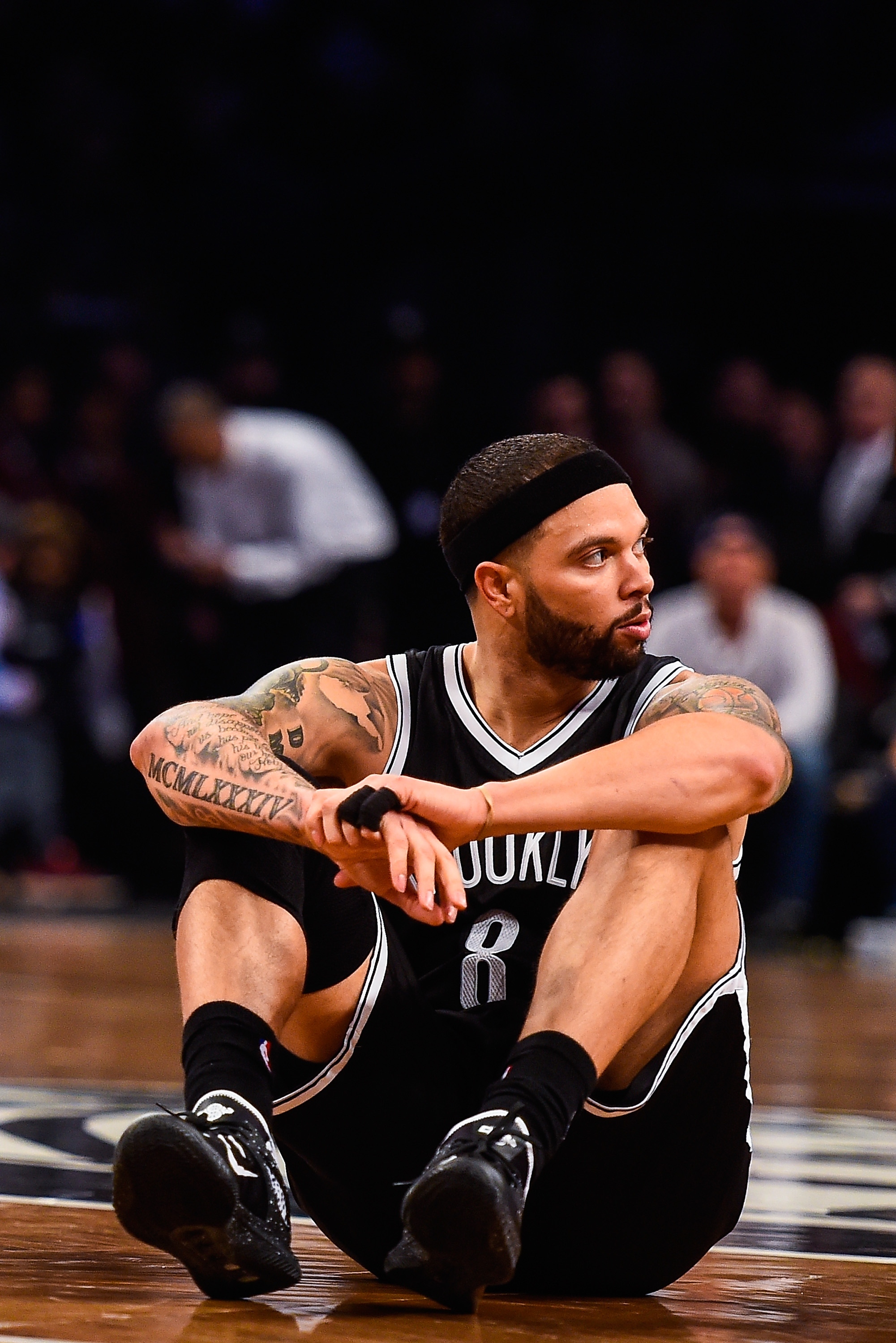 NEW YORK, NY - APRIL 25: Deron Williams #8 of the Brooklyn Nets looks on during the first round of the 2015 NBA Playoffs against the Atlanta Hawks at Barclays Center on April 25, 2015 in the Brooklyn borough of New York City. NOTE TO USER: User expressly acknowledges and agrees that, by downloading and/or using this photograph, user is consenting to the terms and conditions of the Getty Images License Agreement.  (Photo by Alex Goodlett/Getty Images)