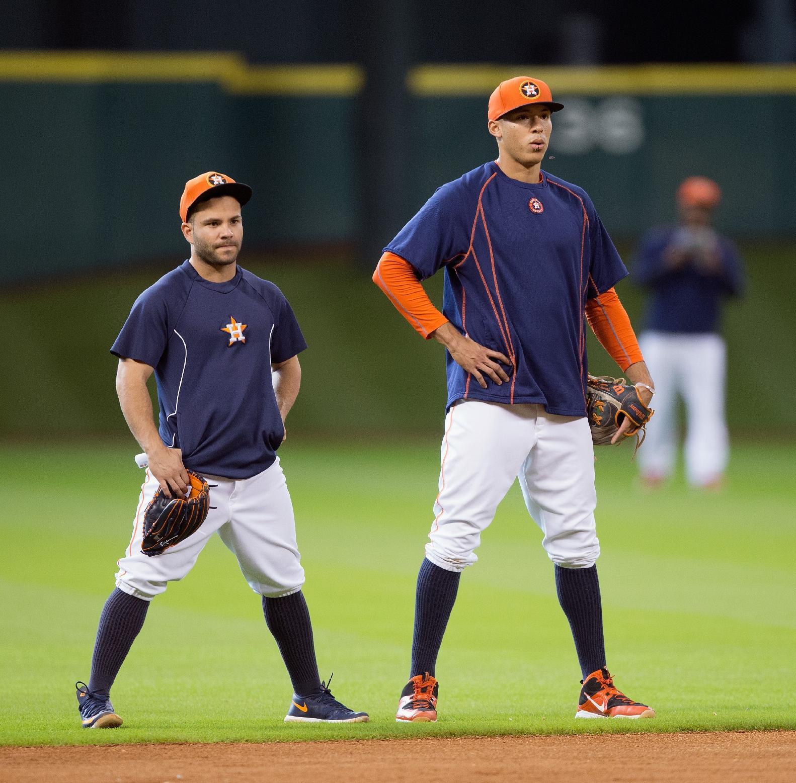 Jose Altuve, left, has assumed the role of big brother to Carlos Correa. (Getty Images)