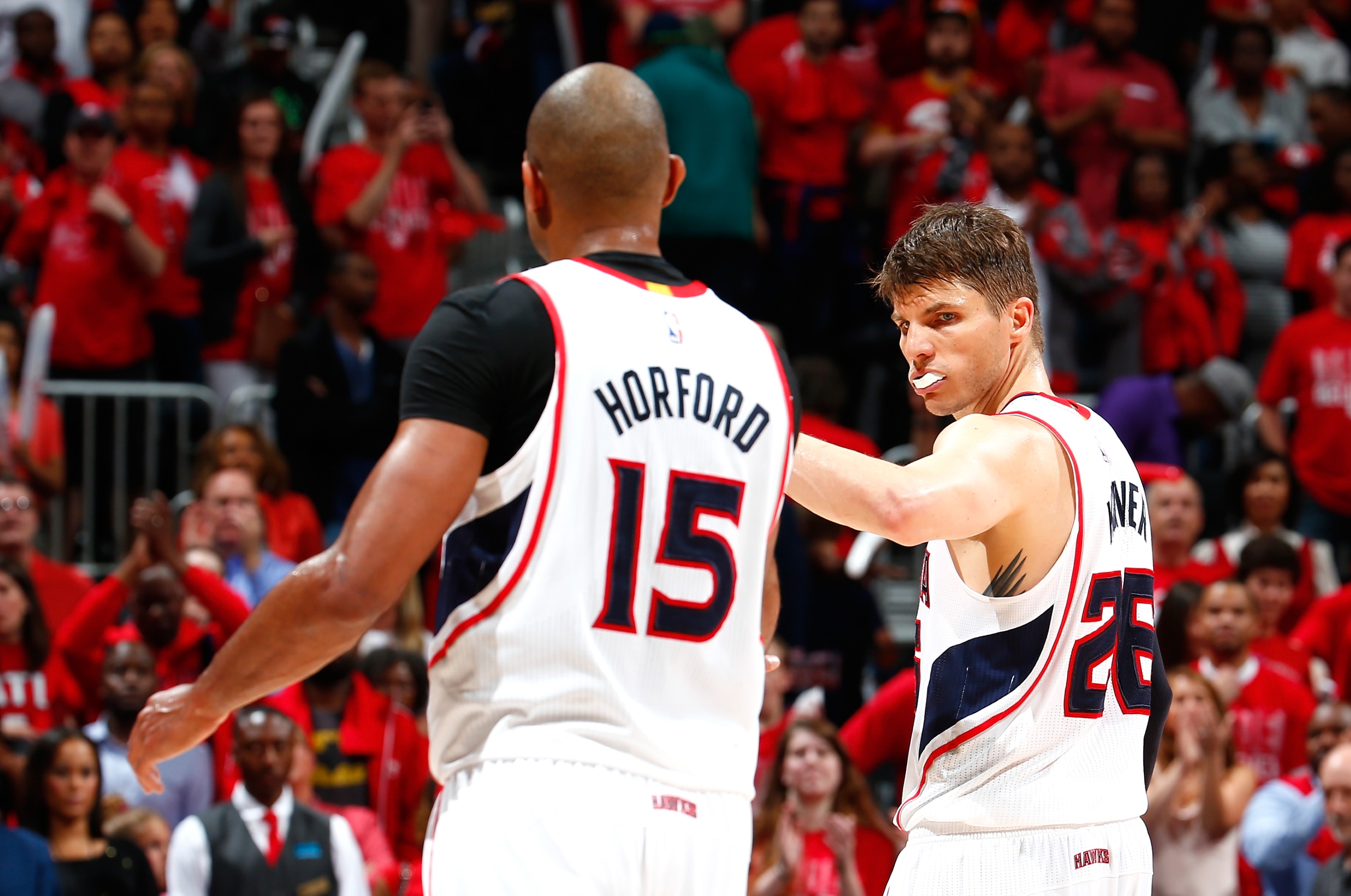 Al Horford and Kyle Korver celebrate a tough win. (Kevin C. Cox/Getty Images)