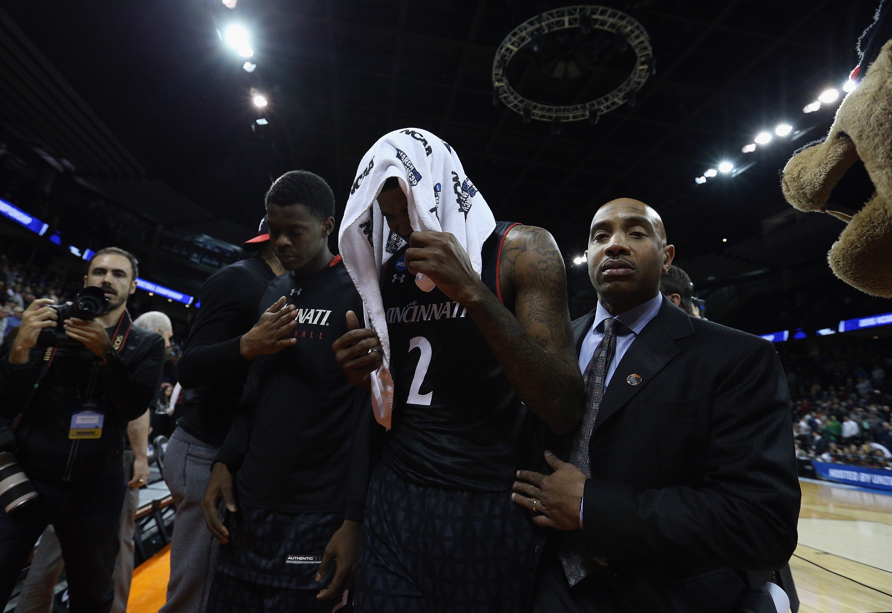 SPOKANE, WA - MARCH 18:  Octavius Ellis #2 of the Cincinnati Bearcats covers his face with a towel as he leaves the court after their 76-78 loss to the Saint Joseph's Hawks during the first round of the 2016 NCAA Men's Basketball Tournament at Spokane Veterans Memorial Arena on March 18, 2016 in Spokane, Washington.  (Photo by Patrick Smith/Getty Images)