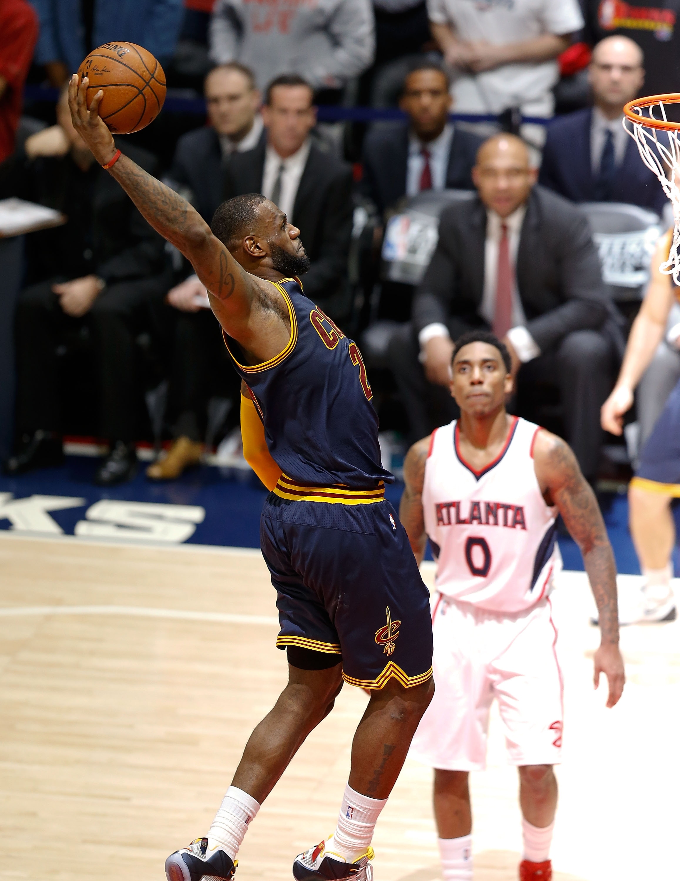 ATLANTA, GA - MAY 20:  Forward LeBron James #23 of the Cleveland Cavaliers dunks to seal the game while guard Jeff Teague #0 of the Atlanta Hawks looks on during Game One of the Eastern Conference Finals during the NBA Playoffs at Philips Arena on May 20, 2015 in Atlanta, Georgia.  NOTE TO USER:  User expressly acknowledges and agrees that, by downloading and or using this photograph, User is consenting to the terms and conditions of the Getty Images License Agreement.  (Photo by Mike Zarrilli/Getty Images)