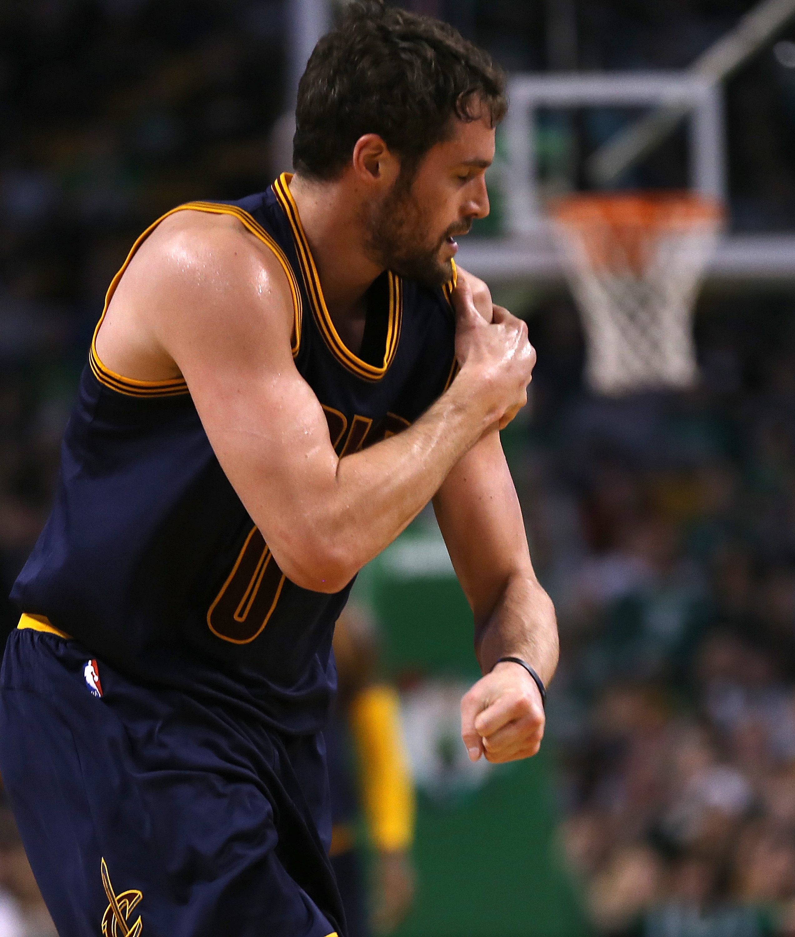 BOSTON, MA - APRIL 26: Kevin Love #0 of the Cleveland Cavaliers reacts after an shoulder injury against the Boston Celtics in the first quarter in Game Four during the first round of the 2015 NBA Playoffs on April 26, 2015 at TD Garden in Boston, Massachusetts. (Photo by Jim Rogash/Getty Images)