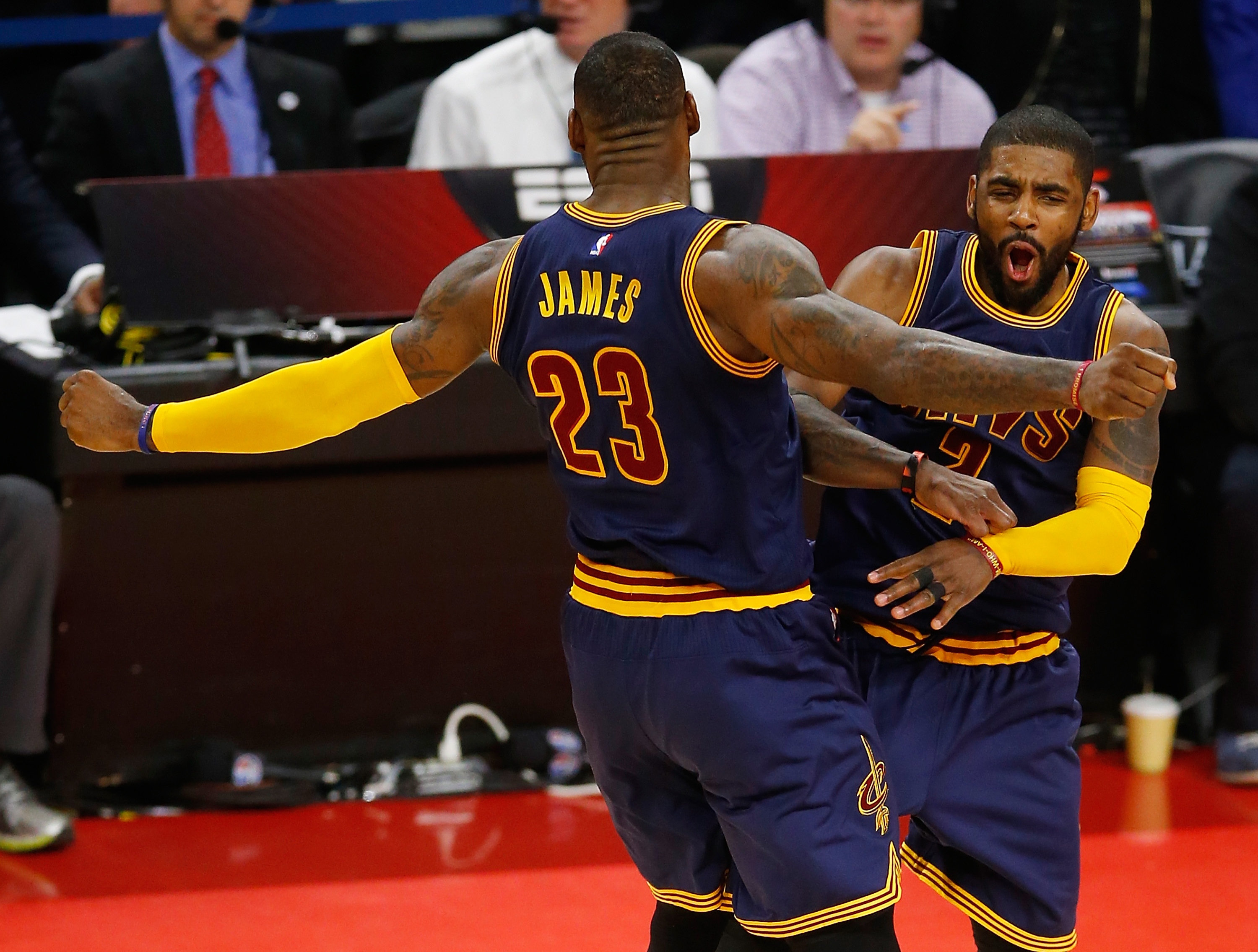 Kyrie Irving and LeBron James celebrate being one win away from Round 2. (Gregory Shamus/Getty Images)