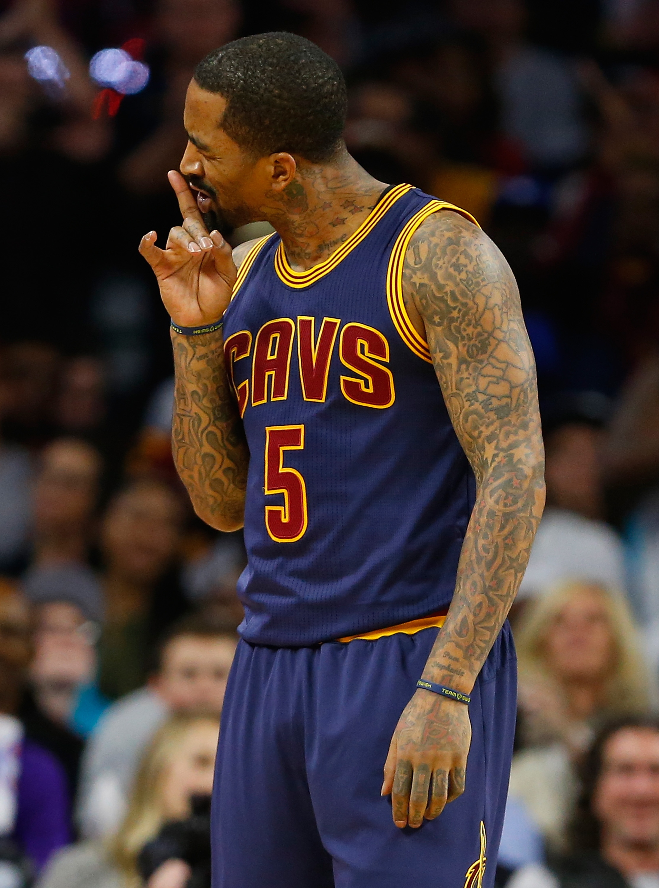 J.R. Smith asks his daughter to keep quiet. (Gregory Shamus/Getty Images)