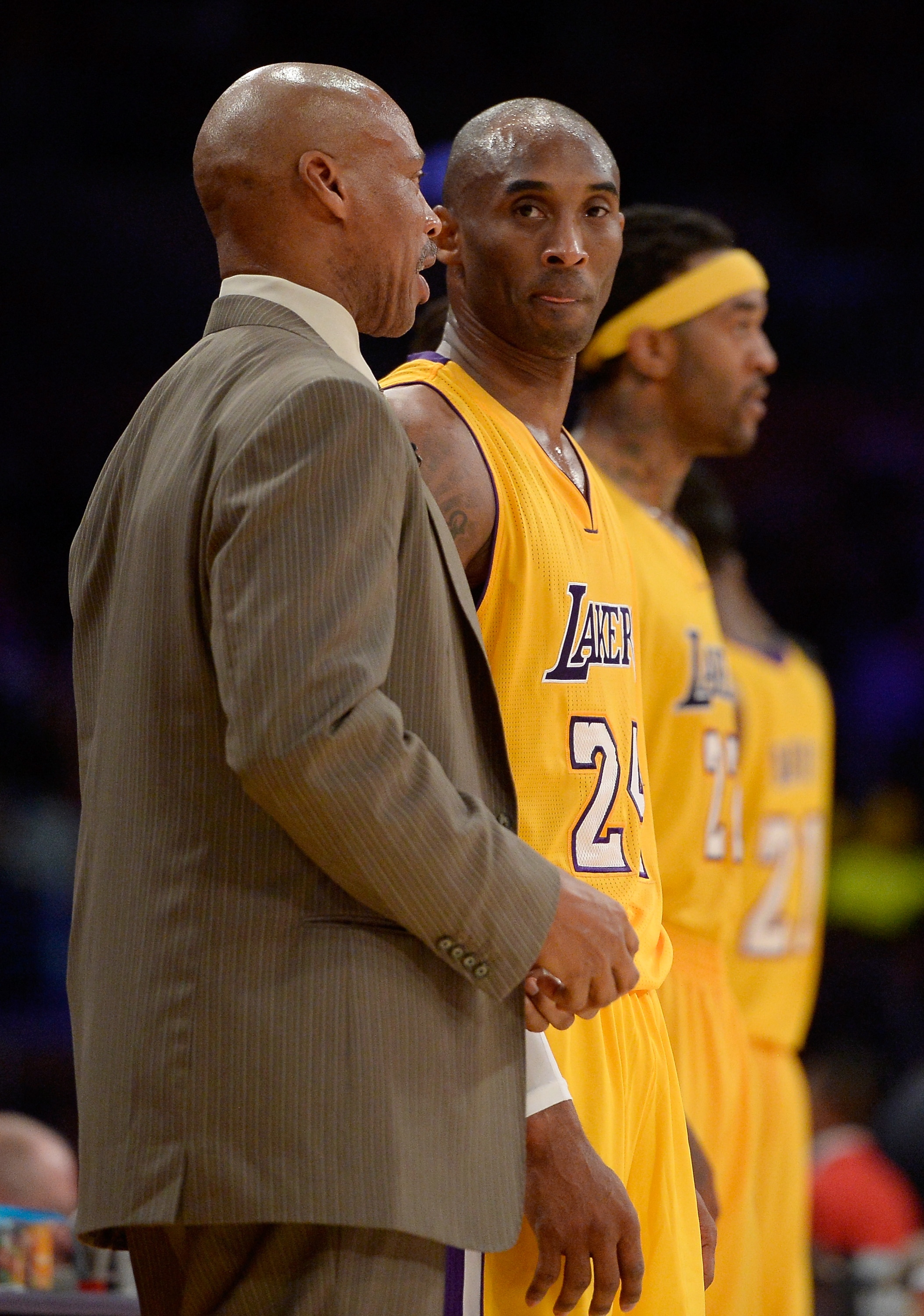 LOS ANGELES, CA - JANUARY 15:  Kobe Bryant #24 of the Los Angeles Lakers talks with Head Coach Byron Scott during a 109-102 loss to the Cleveland Cavaliers at Staples Center on January 15, 2015 in Los Angeles, California.  NOTE TO USER: User expressly acknowledges and agrees that, by downloading and or using this Photograph, user is consenting to the terms and condition of the Getty Images License Agreement.  (Photo by Harry How/Getty Images)