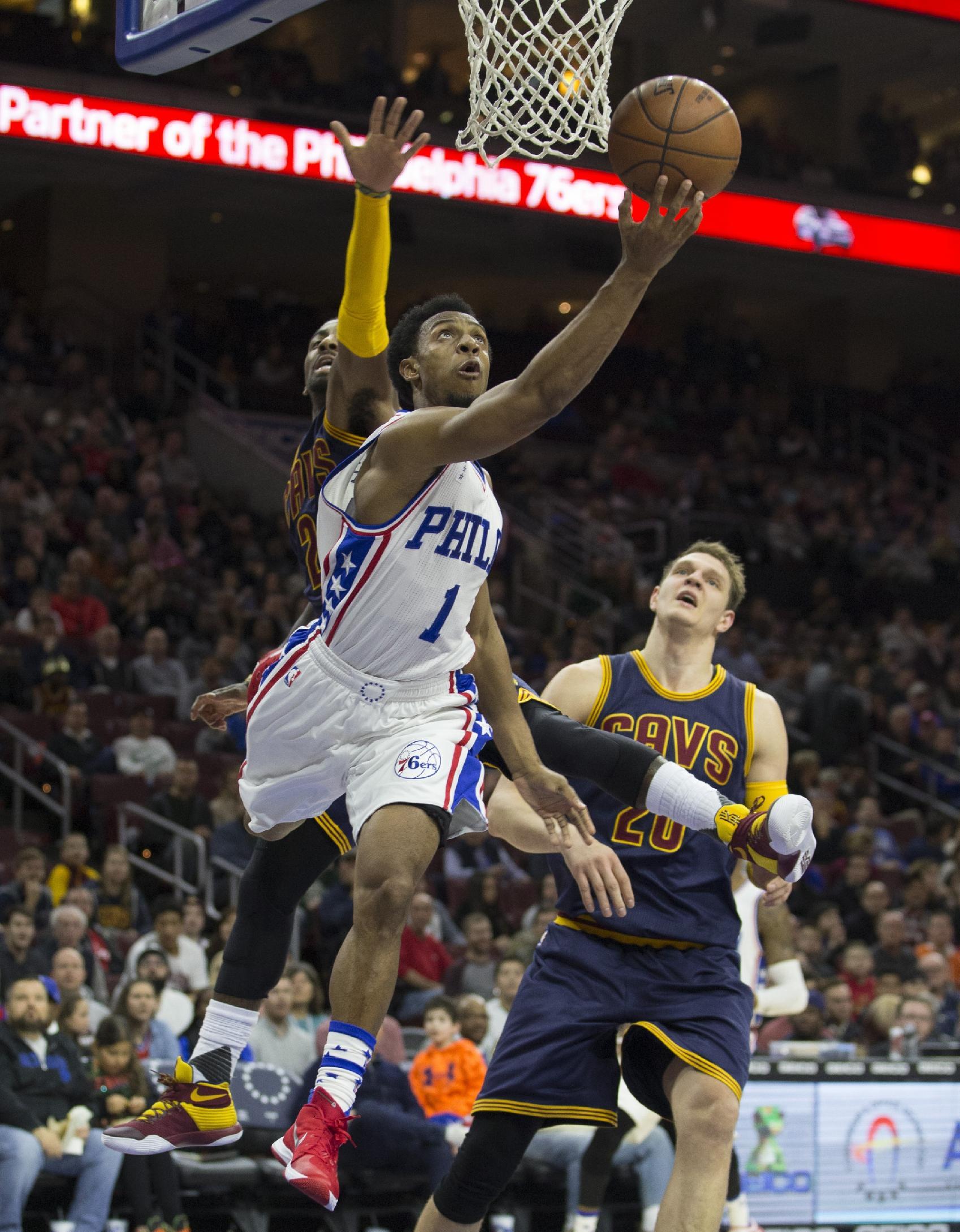 PHILADELPHIA, PA - JANUARY 10:  Ish Smith #1 of the Philadelphia 76ers attempts a shot over Kyrie Irving #2 of the Cleveland Cavaliers on January 10, 2016 at the Wells Fargo Center in Philadelphia, Pennsylvania. NOTE TO USER: User expressly acknowledges and agrees that, by downloading and or using this photograph, User is consenting to the terms and conditions of the Getty Images License Agreement. (Photo by Mitchell Leff/Getty Images)