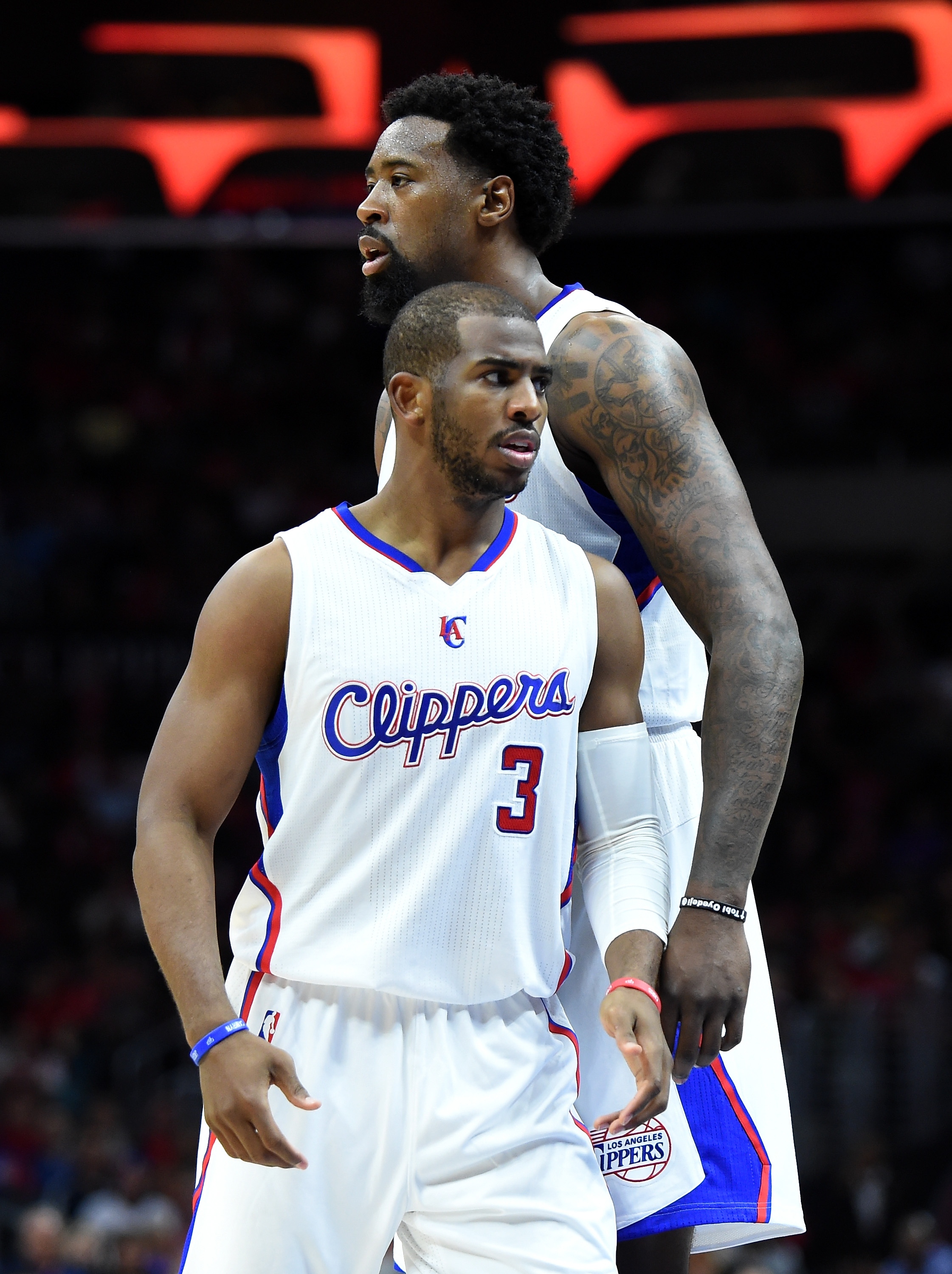 LOS ANGELES, CA - APRIL 13:  DeAndre Jordan #6 and Chris Paul #3 of the Los Angeles Clippers during a 110-103 Clipper win over the Denver Nuggets at Staples Center on April 13, 2015 in Los Angeles, California.  NOTE TO USER: User expressly acknowledges and agrees that, by downloading and or using this Photograph, user is consenting to the terms and condition of the Getty Images License Agreement.  (Photo by Harry How/Getty Images)