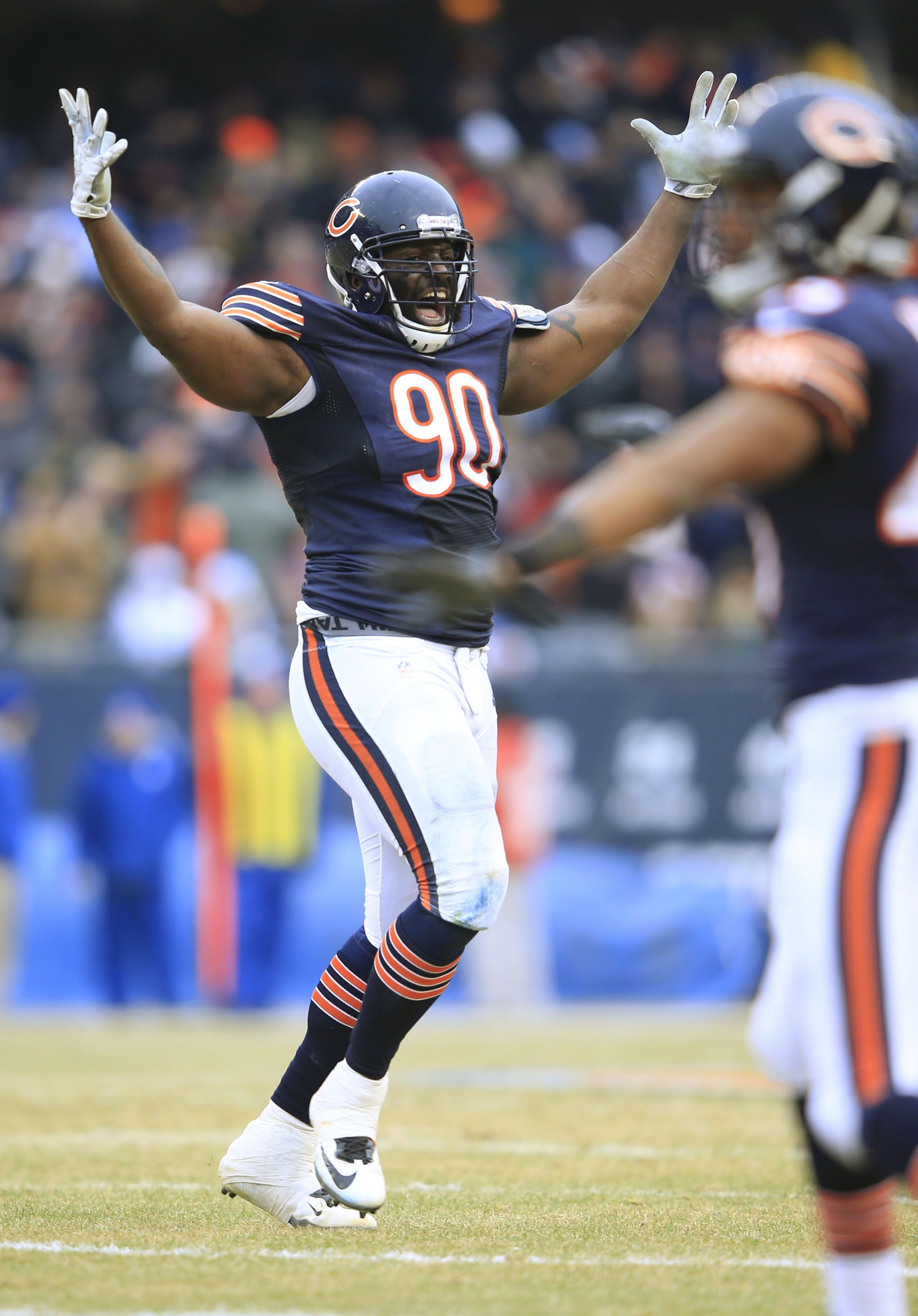 CHICAGO, IL - DECEMBER 21: Jeremiah Ratliff #90 of the Chicago Bears  celebrates a blocked field goal during the fourth quarter of a game against the Detroit Lions at Soldier Field on December 21, 2014 in Chicago, Illinois. The Lions defeated the Bears 20-14. (Photo by Jamie Squire/Getty Images)