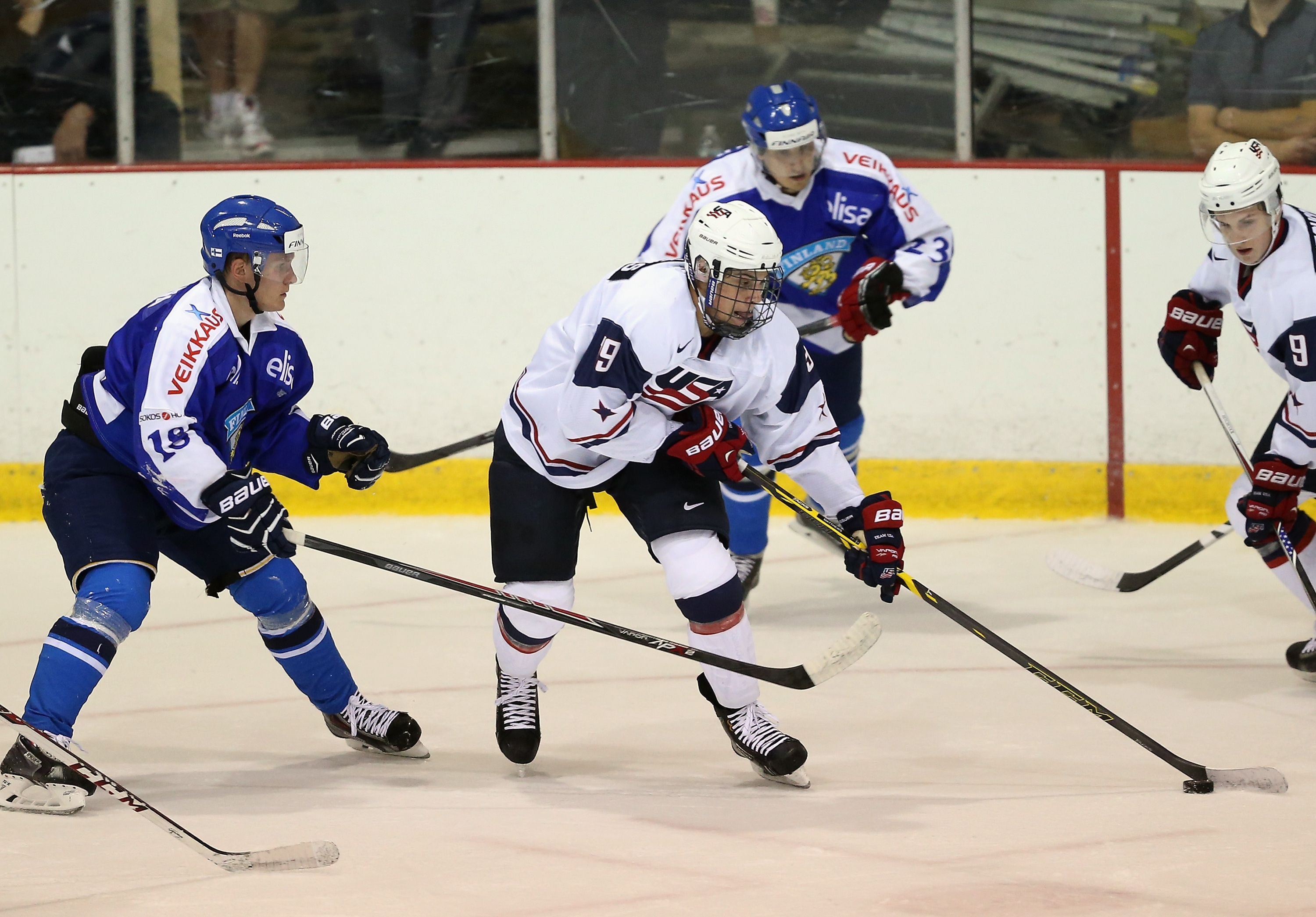 LAKE PLACID, NY - AUGUST 04: Auston Matthews #19 of USA White moves the puck around Saku Kinnunen #18 of Team Finland during the 2014 USA Hockey Junior Evaluation Campat Lake Placid Olympic Center on August 4, 2014 in Lake Placid, New York. (Photo by Bruce Bennett/Getty Images)