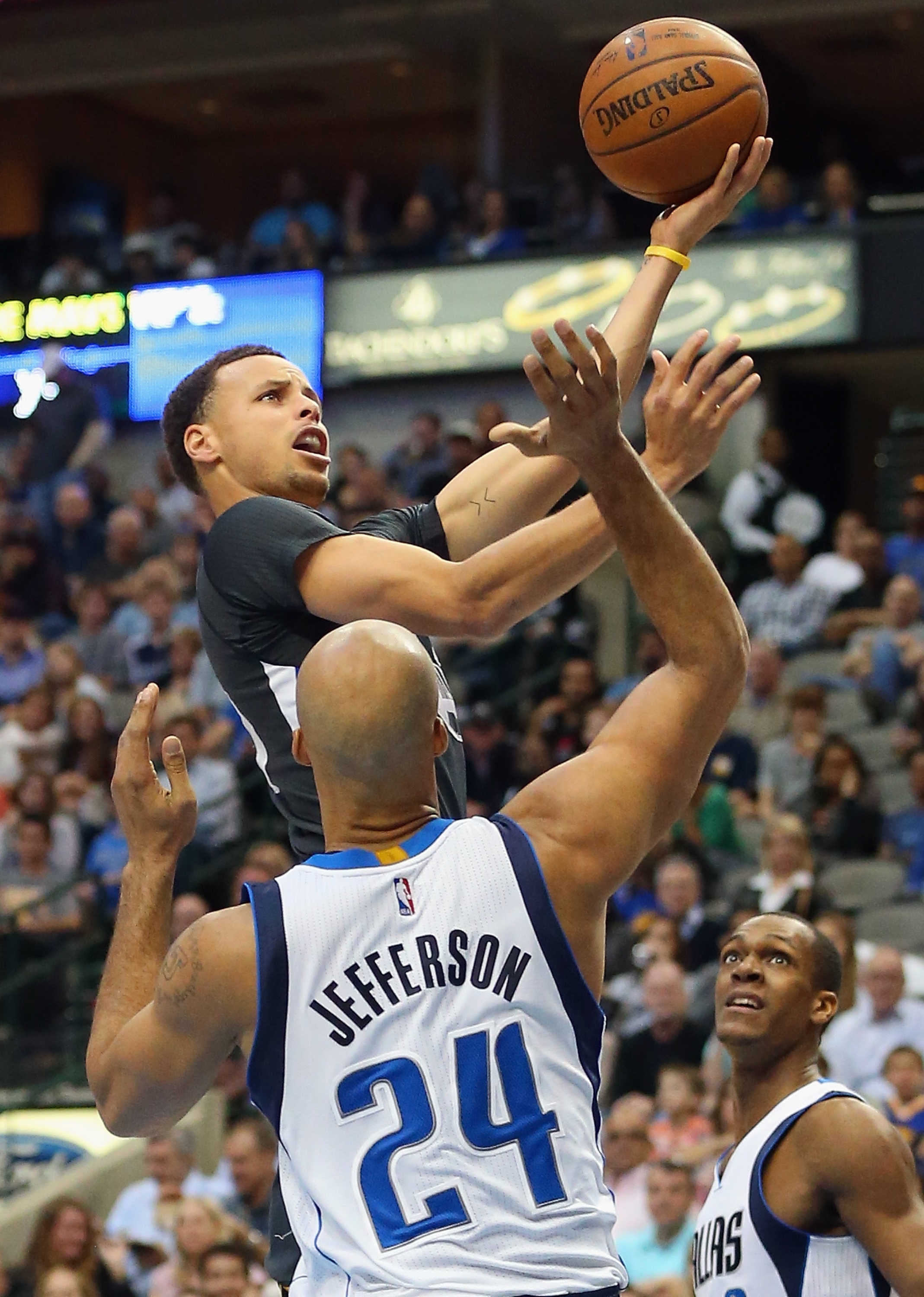 DALLAS, TX - APRIL 04: Stephen Curry #30 of the Golden State Warriors takes a shot against Richard Jefferson #24 of the Dallas Mavericks at American Airlines Center on April 4, 2015 in Dallas, Texas. NOTE TO USER: User expressly acknowledges and agrees that, by downloading and or using this photograph, User is consenting to the terms and conditions of the Getty Images License Agreement. (Photo by Ronald Martinez/Getty Images)