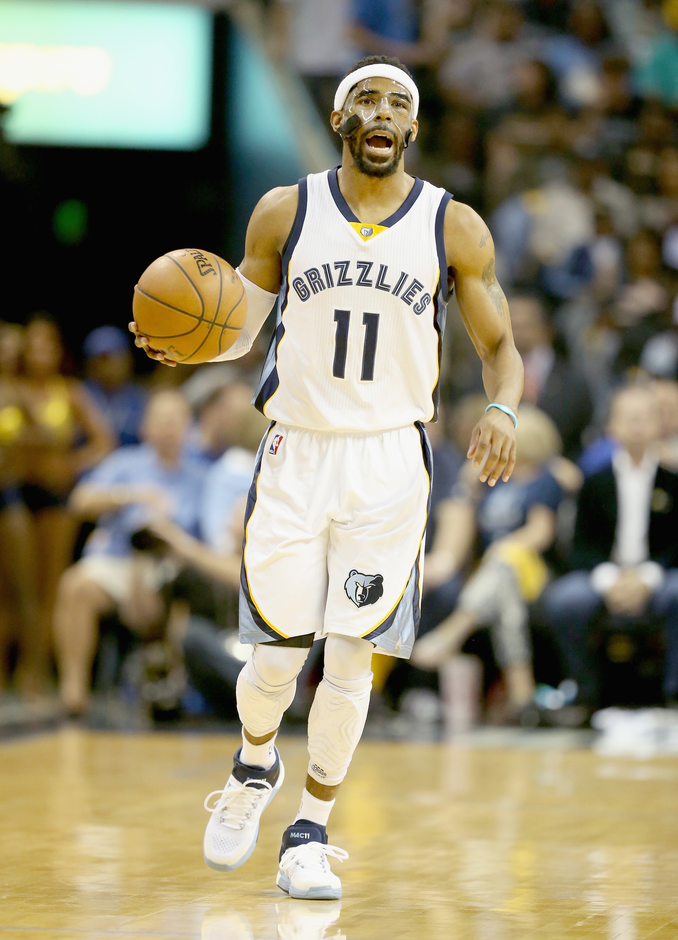 MEMPHIS, TN - MAY 15: Mike Conley #11 of the Memphis Grizzlies dribbles the ball against the Golden State Warriors during Game six of the Western Conference Semifinals of the 2015 NBA Playoffs at FedExForum on May 15, 2015 in Memphis, Tennessee.  NOTE TO USER: User expressly acknowledges and agrees that, by downloading and or using this photograph, User is consenting to the terms and conditions of the Getty Images License Agreement  (Photo by Andy Lyons/Getty Images)