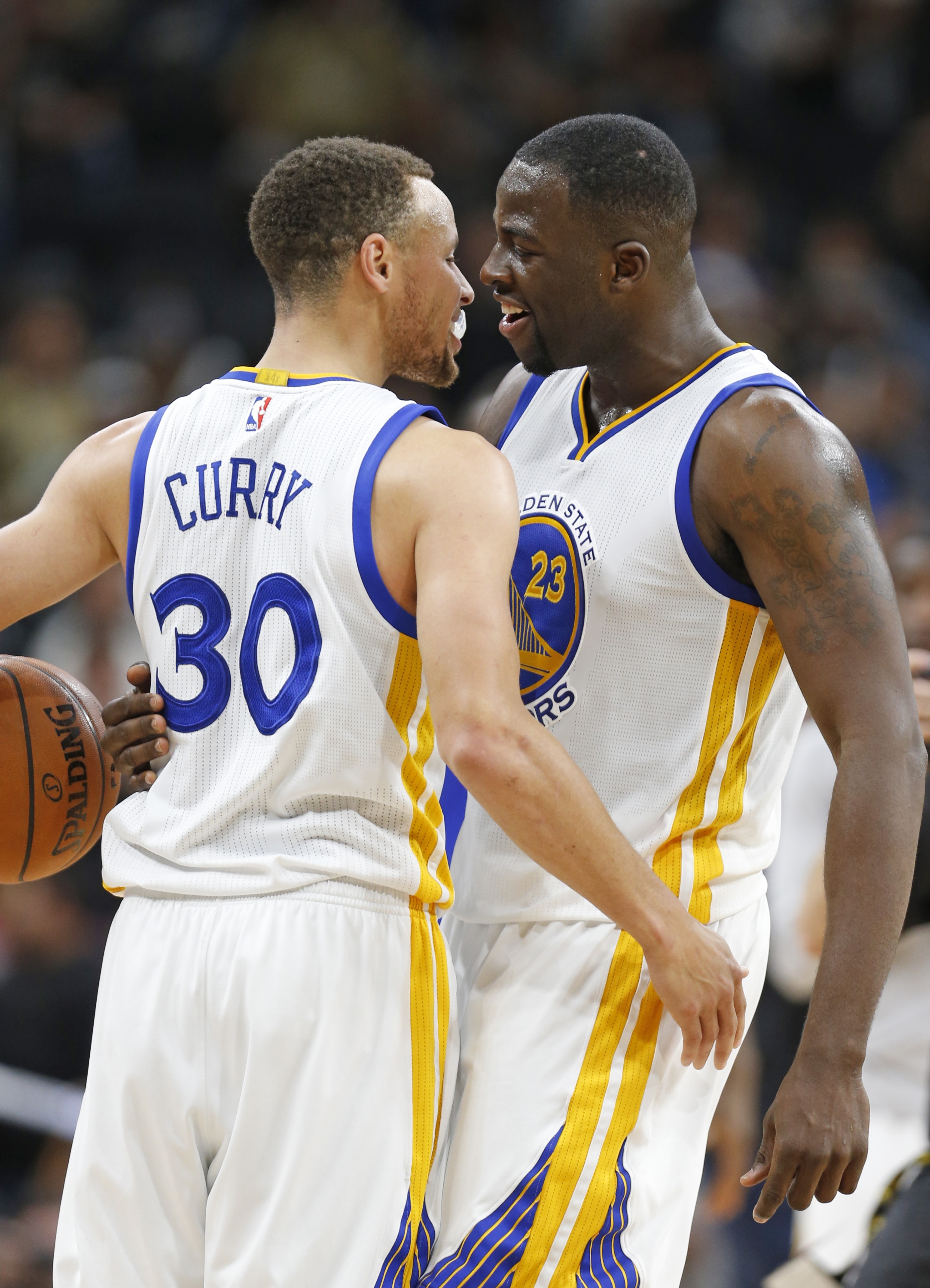 Curry and Green celebrate their first-round matchup. (Ronald Cortes/Getty Images)