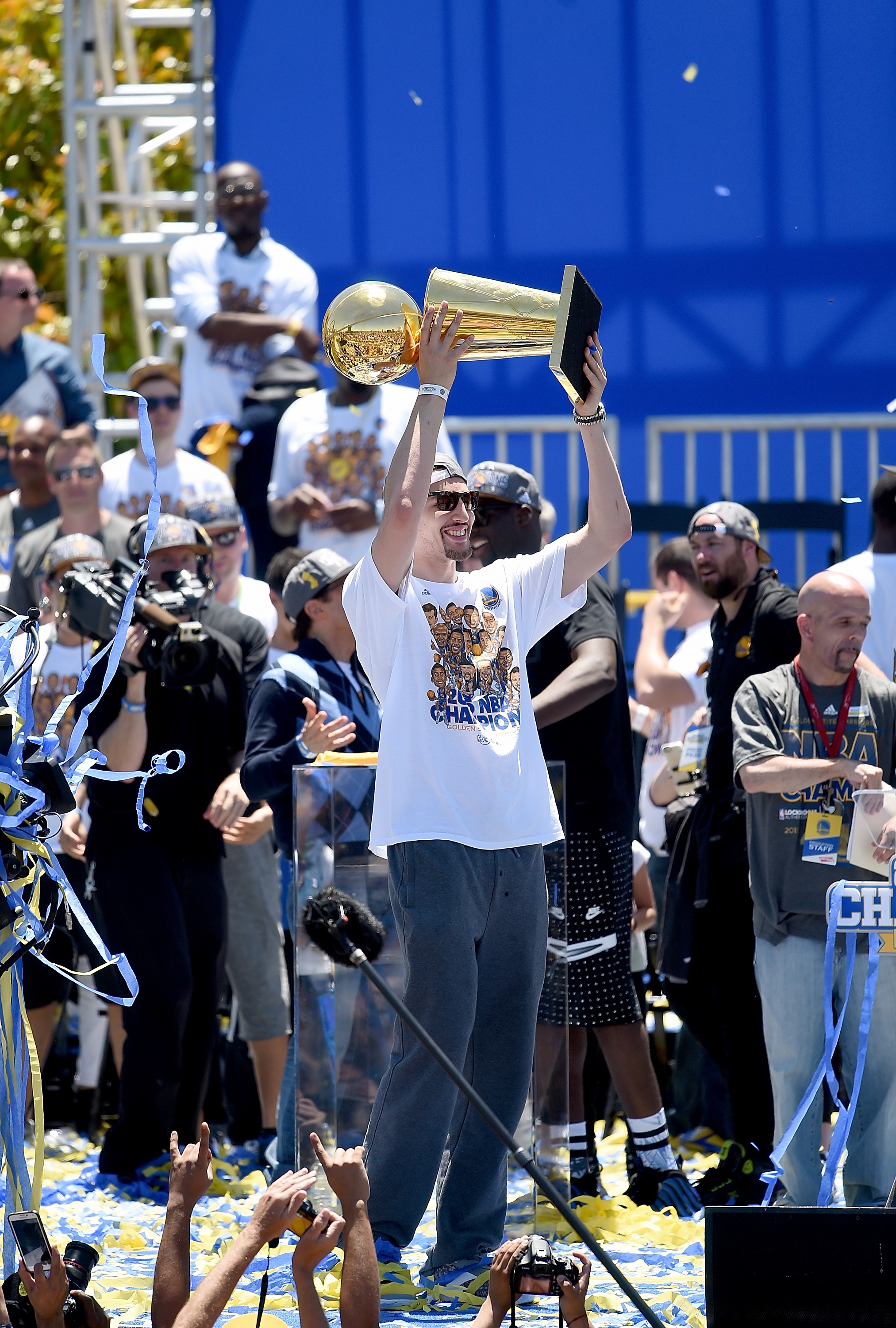OAKLAND, CA - JUNE 19:  Klay Thompson #11 of the Golden State Warriors holding the Larry O'Brien Trophy celebrates with his teammates at The Henry J. Kaiser Convention Center during thier Victory Parade and Rally on June 19, 2015 in Oakland, California.  (Photo by Thearon W. Henderson/Getty Images)