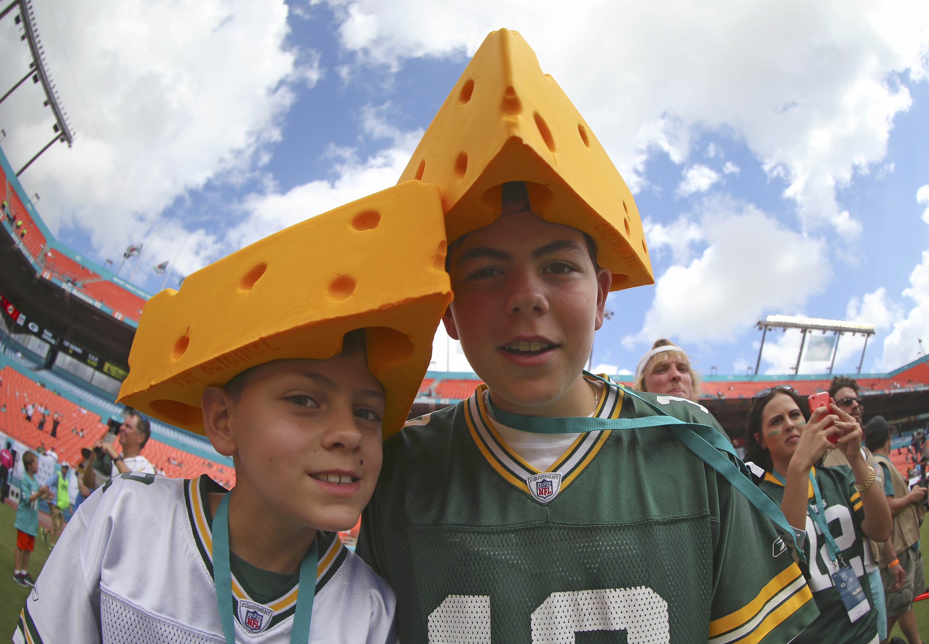 MIAMI GARDENS, FL - OCTOBER 12:  Green Bay Packers fans wear cheese headgear before the Miami Dolphins met the Green Bay Packers in their NFL game at Sun Life Stadium on October 12, 2014 in Miami Gardens, Florida.  (Photo by Mike Ehrmann/Getty Images)