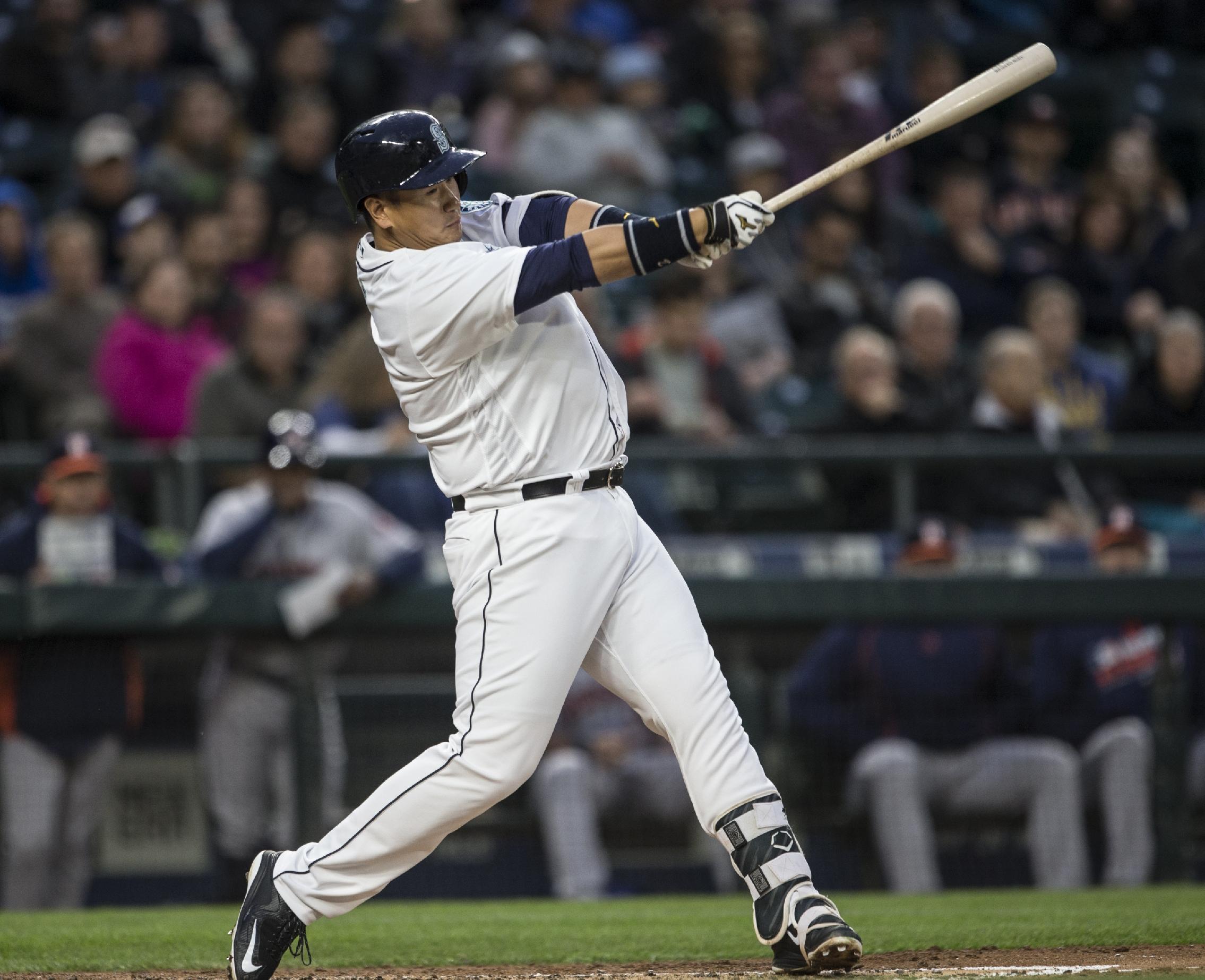 Dae-ho Lee of the Seattle Mariners takes a swing during an at-bat in the third inning. (Photo by Stephen Brashear/Getty Images)