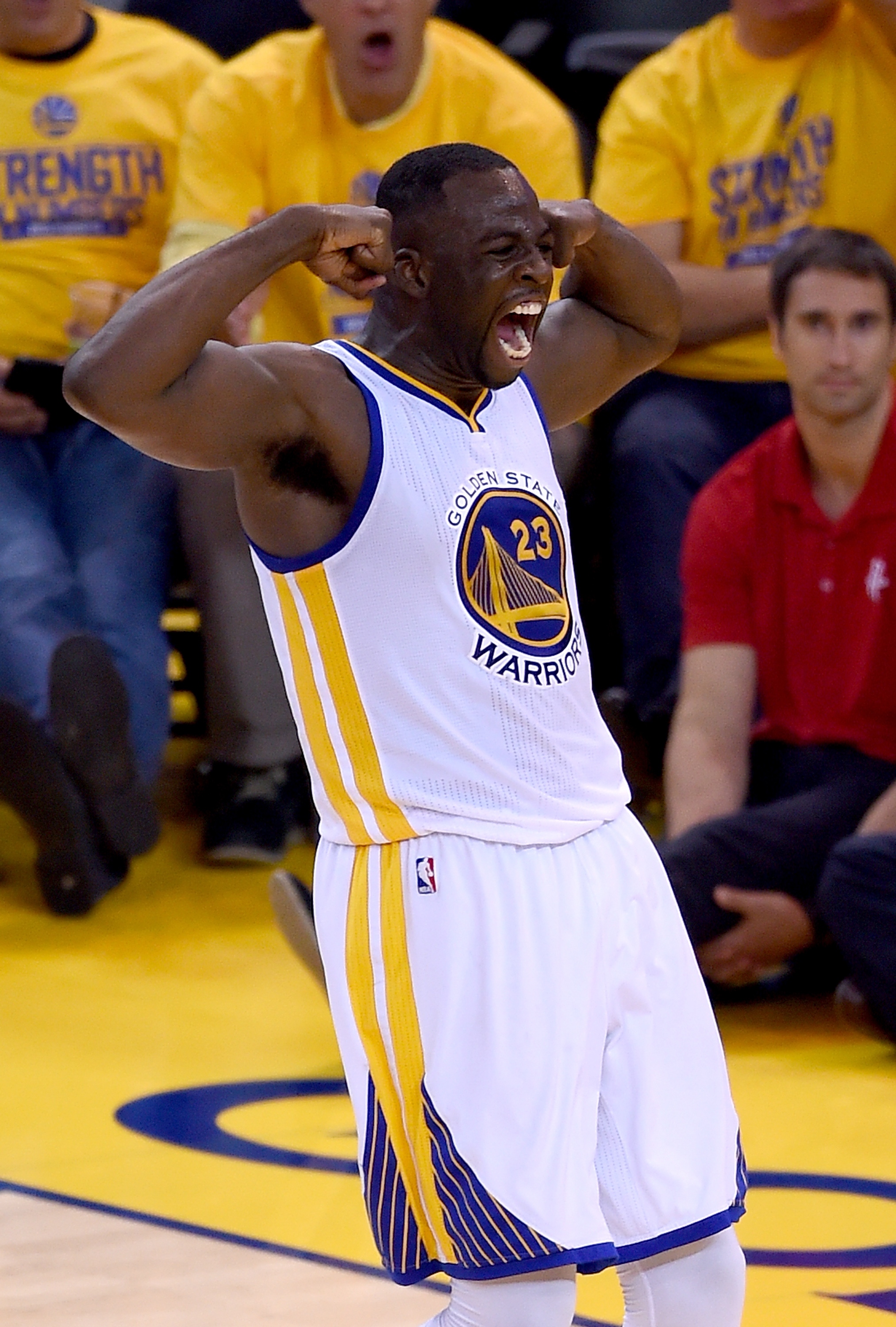 OAKLAND, CA - MAY 21:  Draymond Green #23 of the Golden State Warriors reacts after scoring and being fouled on the shot by Dwight Howard #12 of the Houston Rockets during the second half in Game Two of the Western Conference Finals of the NBA Playoffs at ORACLE Arena on May 21, 2015 in Oakland, California. NOTE TO USER: User expressly acknowledges and agrees that, by downloading and or using this photograph, User is consenting to the terms and conditions of the Getty Images License Agreement.  (Photo by Thearon W. Henderson/Getty Images)