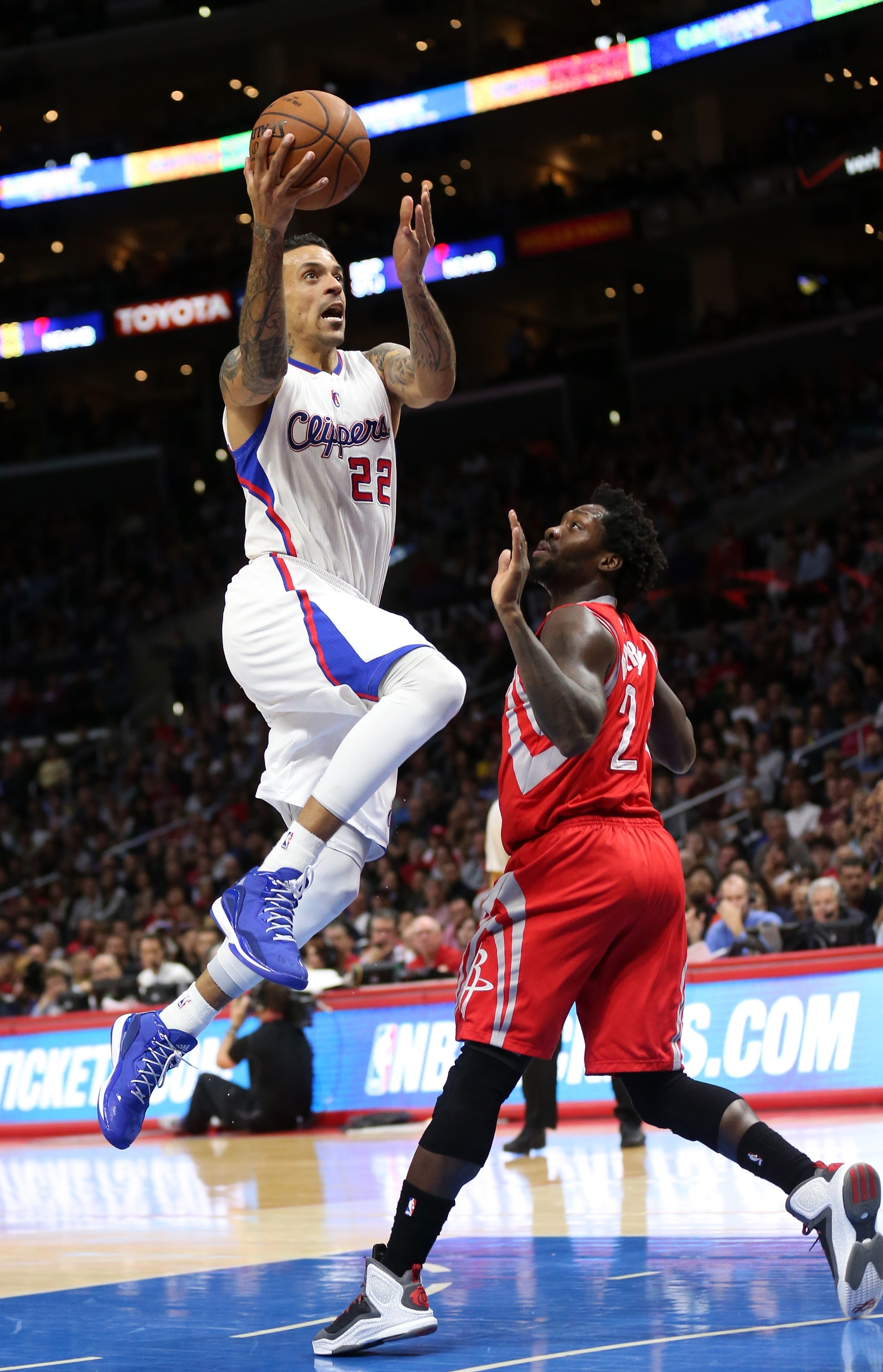 LOS ANGELES, CA - FEBRUARY 11: Matt Barnes #22 of the Los Angeles Clippers goes up for a shot over Patrick Beverley #2 of the Houston Rockets at Staples Center on February 11, 2015 in Los Angeles, California. The Clippers won 105-95. NOTE TO USER: User expressly acknowledges and agrees that, by downloading and or using this photograph, User is consenting to the terms and conditions of the Getty Images License Agreement. (Photo by Stephen Dunn/Getty Images)