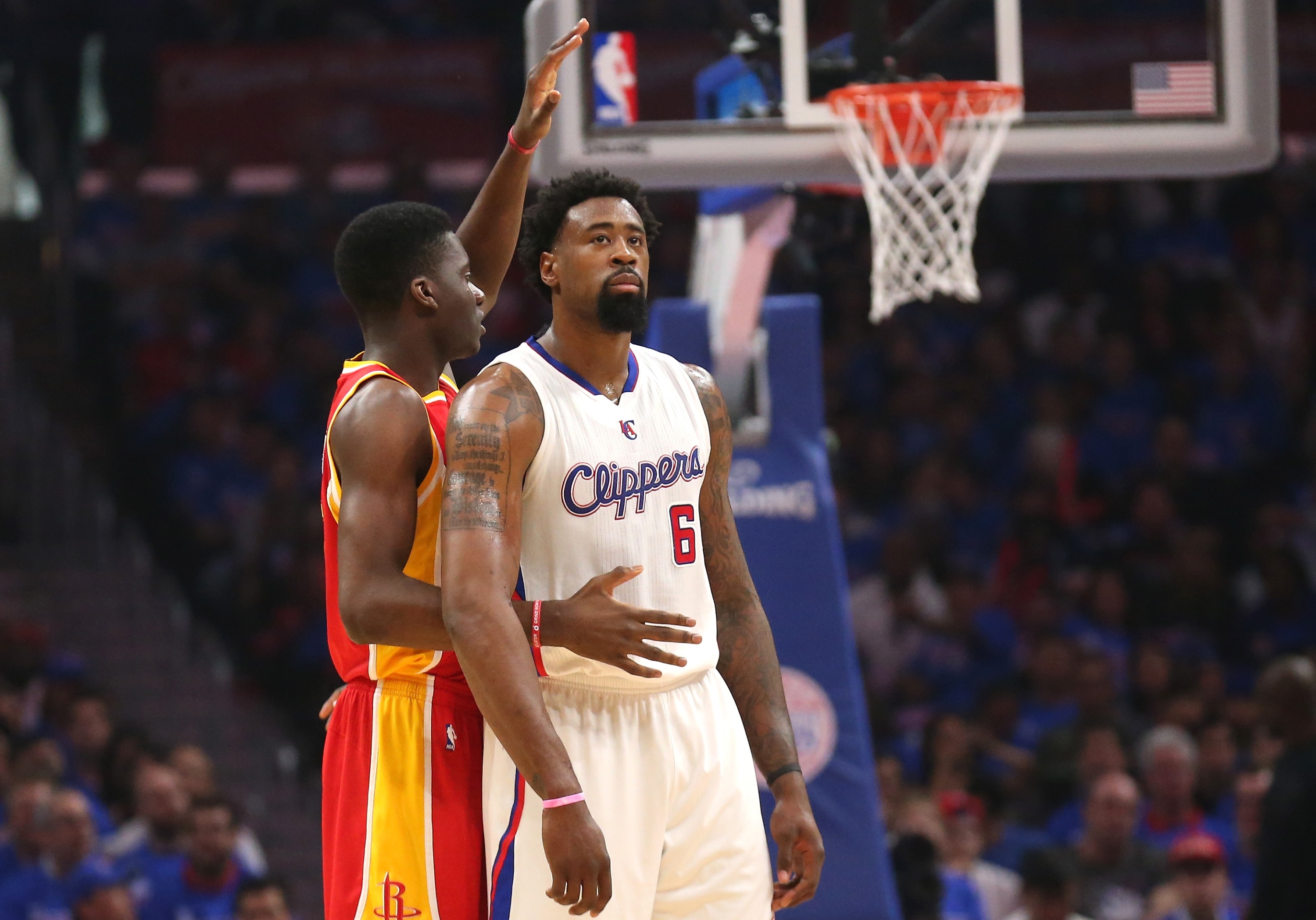 Clint Capela signals as he intentionally fouls DeAndre Jordan. (Stephen Dunn/Getty Images)