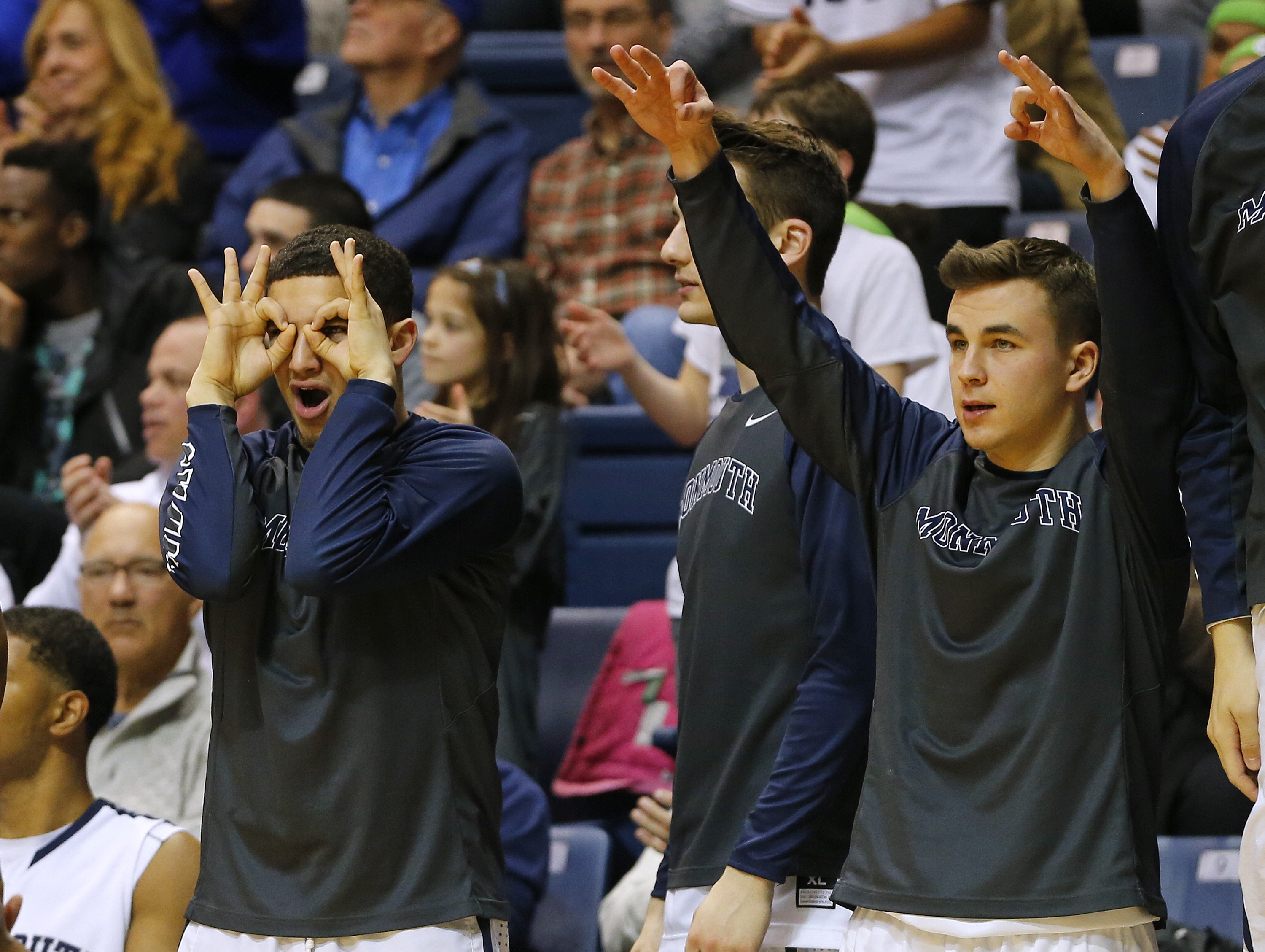 The Monmouth Hawks bench reacts to a three point shot against Iona (Photo by Rich Schultz /Getty Images)