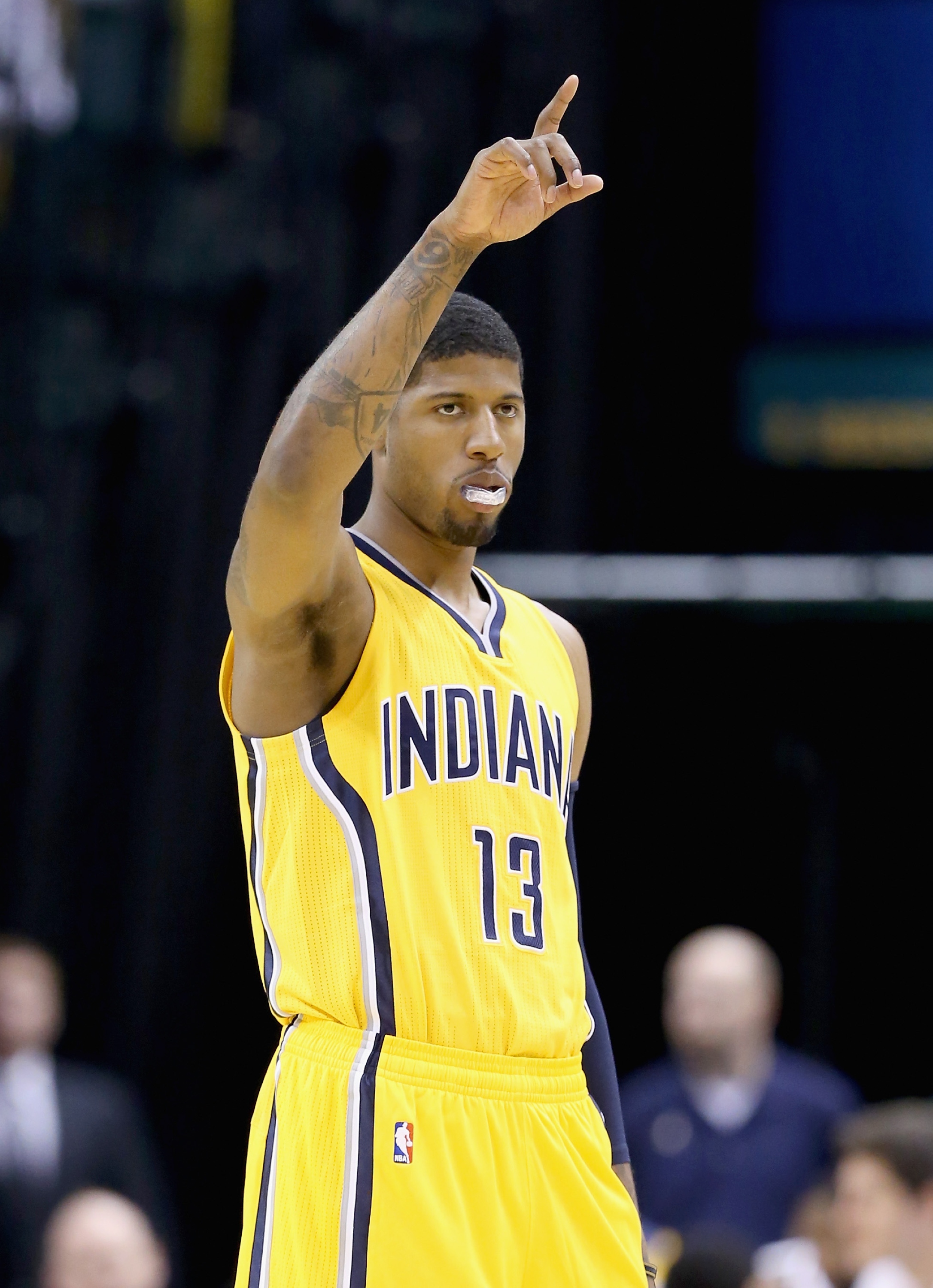 INDIANAPOLIS, IN - APRIL 05: Paul George #13 of the Indiana Pacers celebrates in the game against the Miami Heat at Bankers Life Fieldhouse on April 5, 2015 in Indianapolis, Indiana. Tonight is his first game this season . NOTE TO USER: User expressly acknowledges and agrees that, by downloading and or using this photograph, User is consenting to the terms and conditions of the Getty Images License Agreement. (Photo by Andy Lyons/Getty Images)