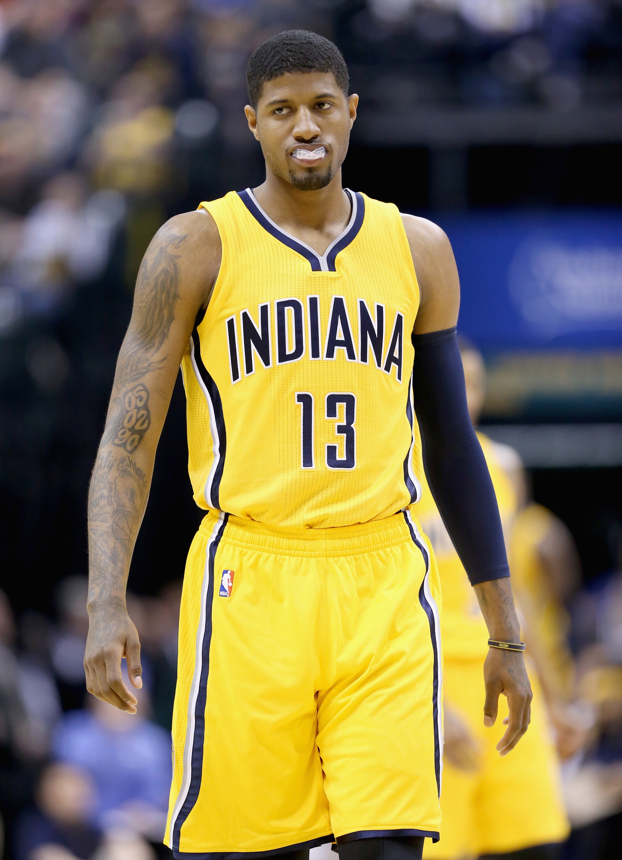 INDIANAPOLIS, IN - APRIL 05: Paul George #13 of the Indiana Pacers watches a free throw during the game against the Miami Heat at Bankers Life Fieldhouse on April 5, 2015 in Indianapolis, Indiana. Tonight is his first game this season . NOTE TO USER: User expressly acknowledges and agrees that, by downloading and or using this photograph, User is consenting to the terms and conditions of the Getty Images License Agreement. (Photo by Andy Lyons/Getty Images)