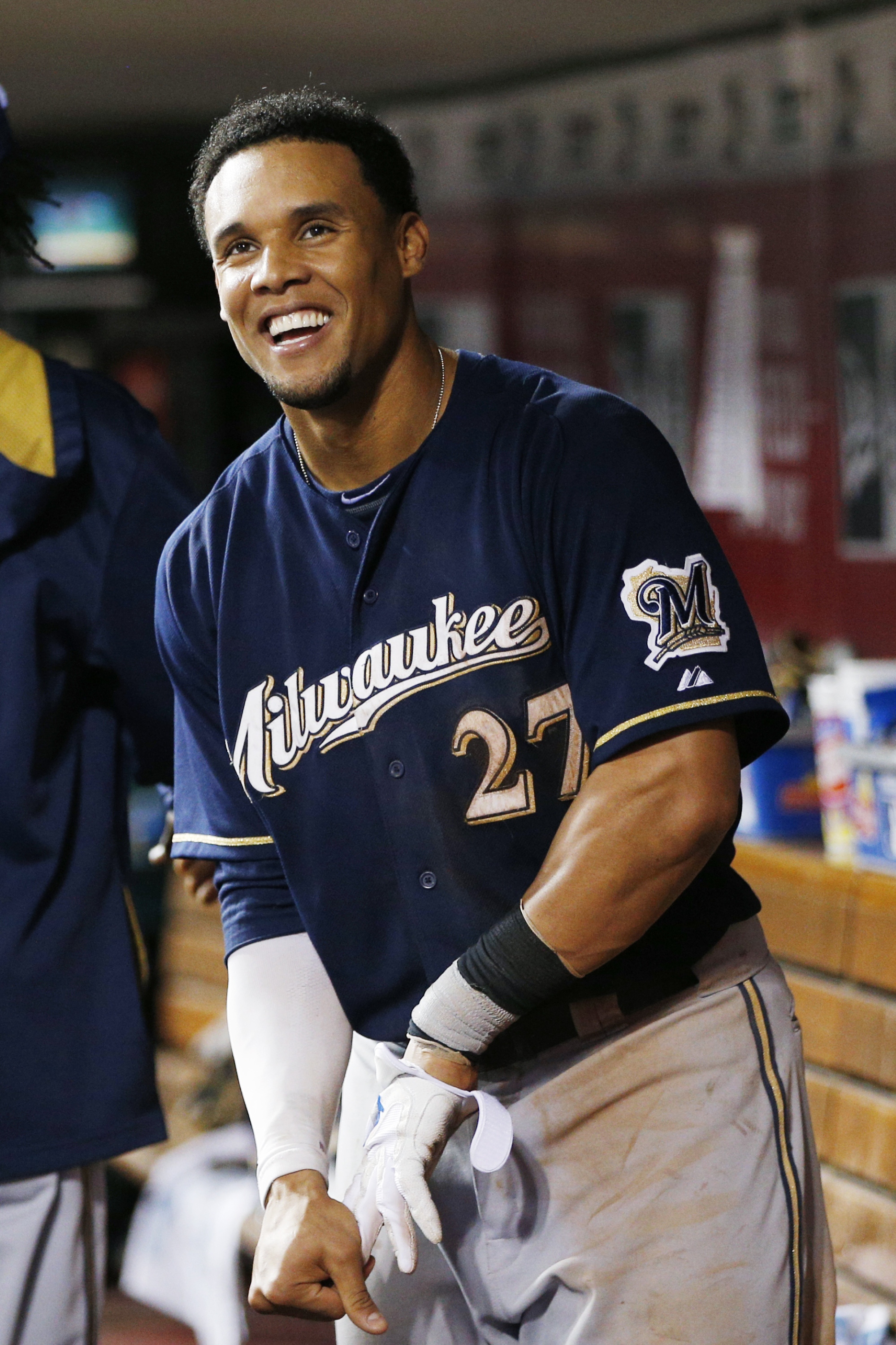 Carlos Gomez smiles after hitting a grand slam in Cincinnati on July 3. (Getty Images)