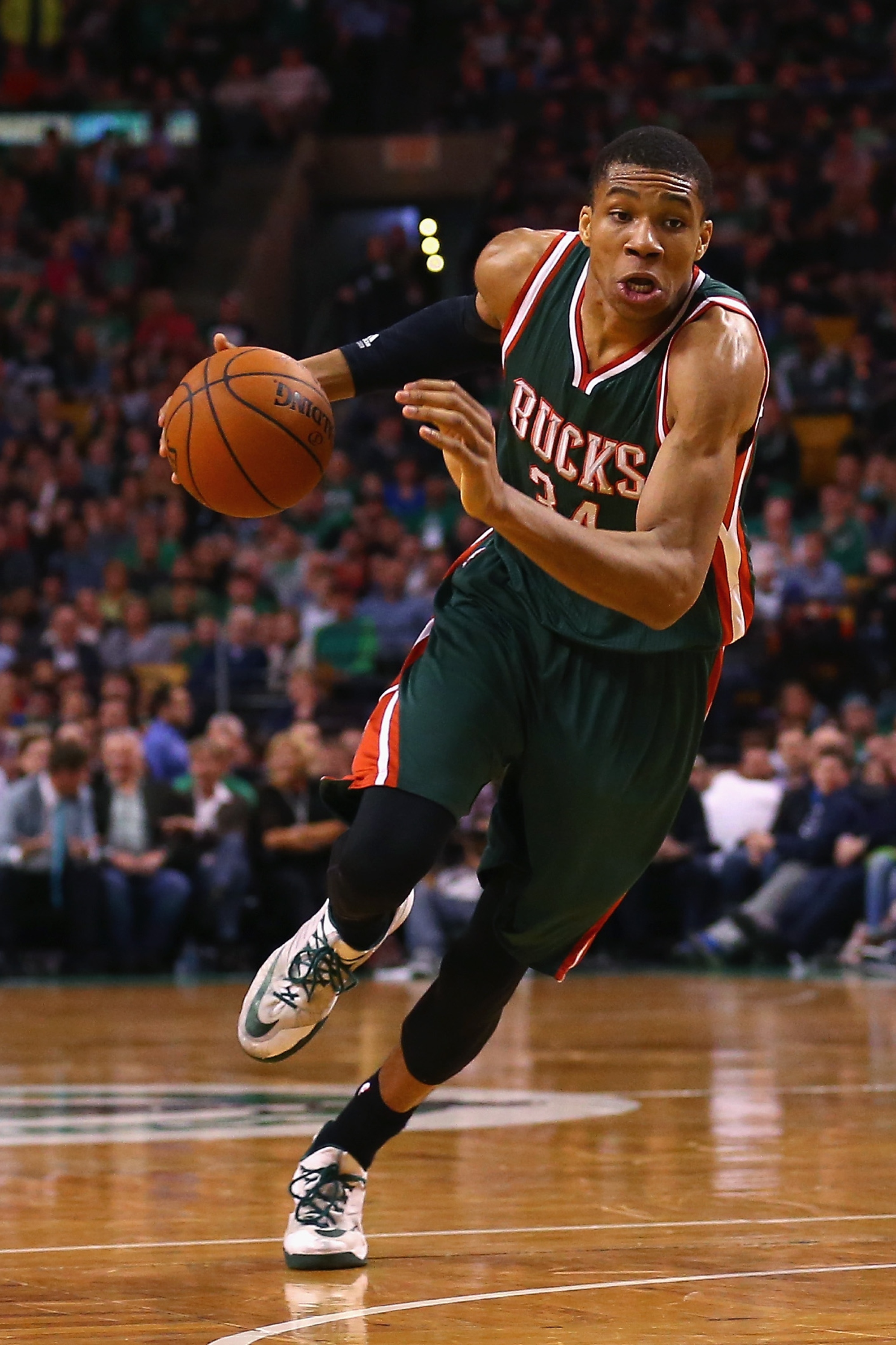 BOSTON, MA - APRIL 03:  Giannis Antetokounmpo #34 of the Milwaukee Bucks carries the ball against the Boston Celtics during the fourth quarter at TD Garden on April 3, 2015 in Boston, Massachusetts. The Bucks defeat the Celtics 110-101. NOTE TO USER: User expressly acknowledges and agrees that, by downloading and/or using this photograph, user is consenting to the terms and conditions of the Getty Images License Agreement.  (Photo by Maddie Meyer/Getty Images)