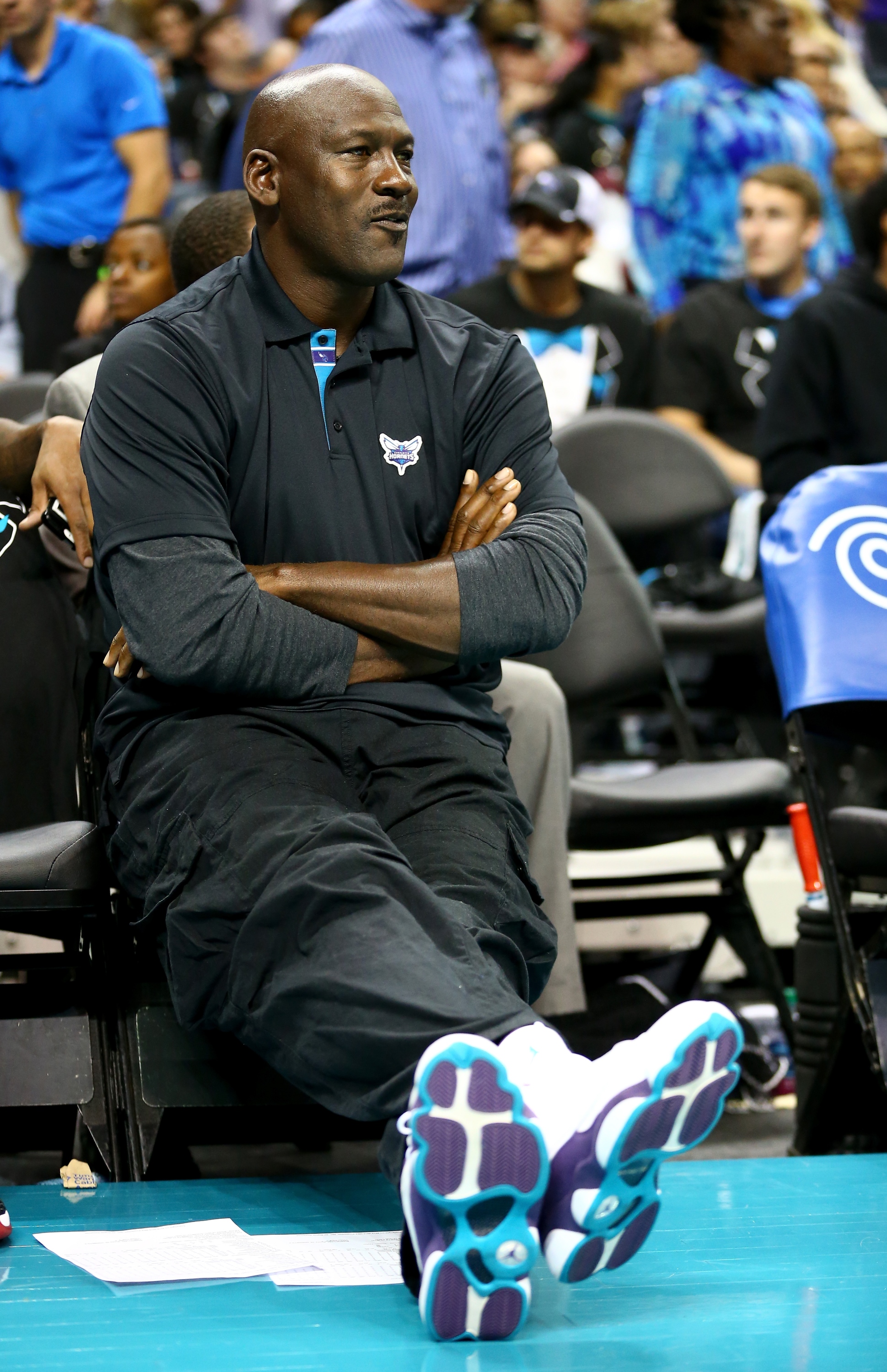 CHARLOTTE, NC - OCTOBER 29:  Michael Jordan, owner of the Charlotte Hornets, watches on during their game against the Milwaukee Bucks at Time Warner Cable Arena on October 29, 2014 in Charlotte, North Carolina.  The Charlotte Hornets defeated the Milwaukee Bucks 108-106 in overtime. NOTE TO USER: User expressly acknowledges and agrees that, by downloading and or using this photograph, User is consenting to the terms and conditions of the Getty Images License Agreement.  (Photo by Streeter Lecka/Getty Images)