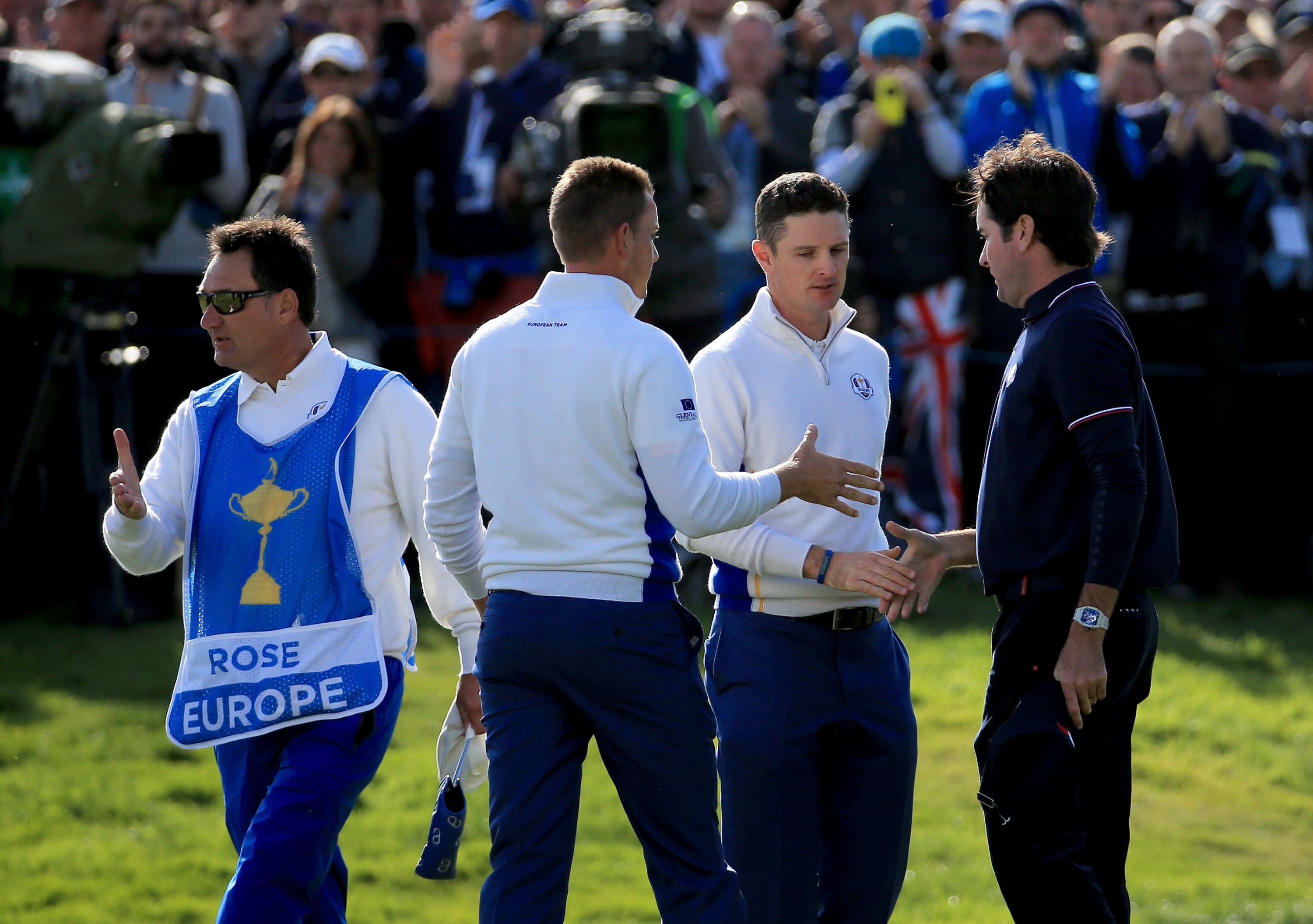 AUCHTERARDER, SCOTLAND - SEPTEMBER 27:  Henrik Stenson and Justin Rose of Europe shake hands with Bubba Watson of the United States after winning their match on the 16th green during the Morning Fourballs of the 2014 Ryder Cup on the PGA Centenary course at the Gleneagles Hotel on September 27, 2014 in Auchterarder, Scotland.  (Photo by David Cannon/Getty Images)