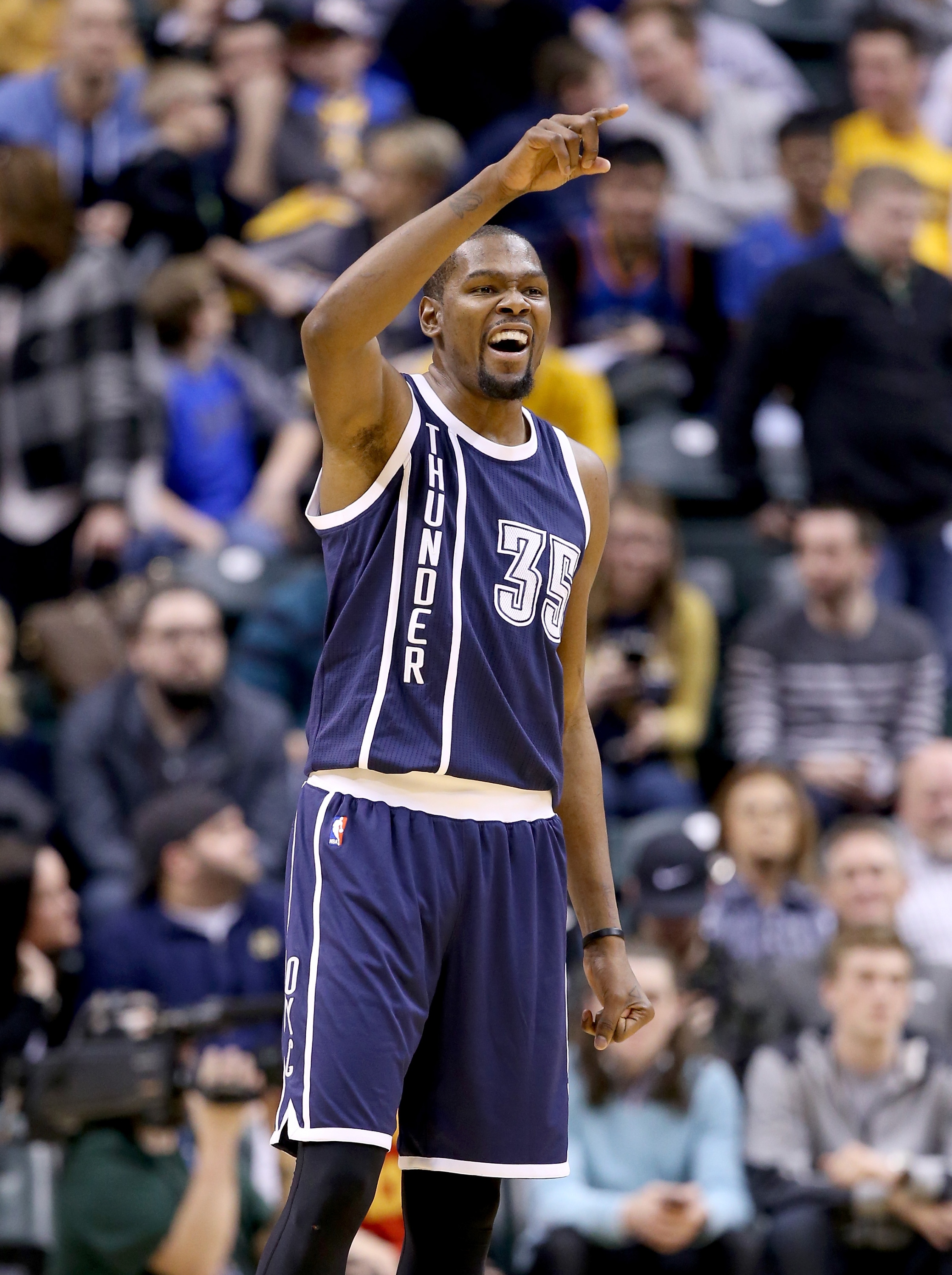 Kevin Durant waves to his superstar friends. (Andy Lyons/Getty Images)