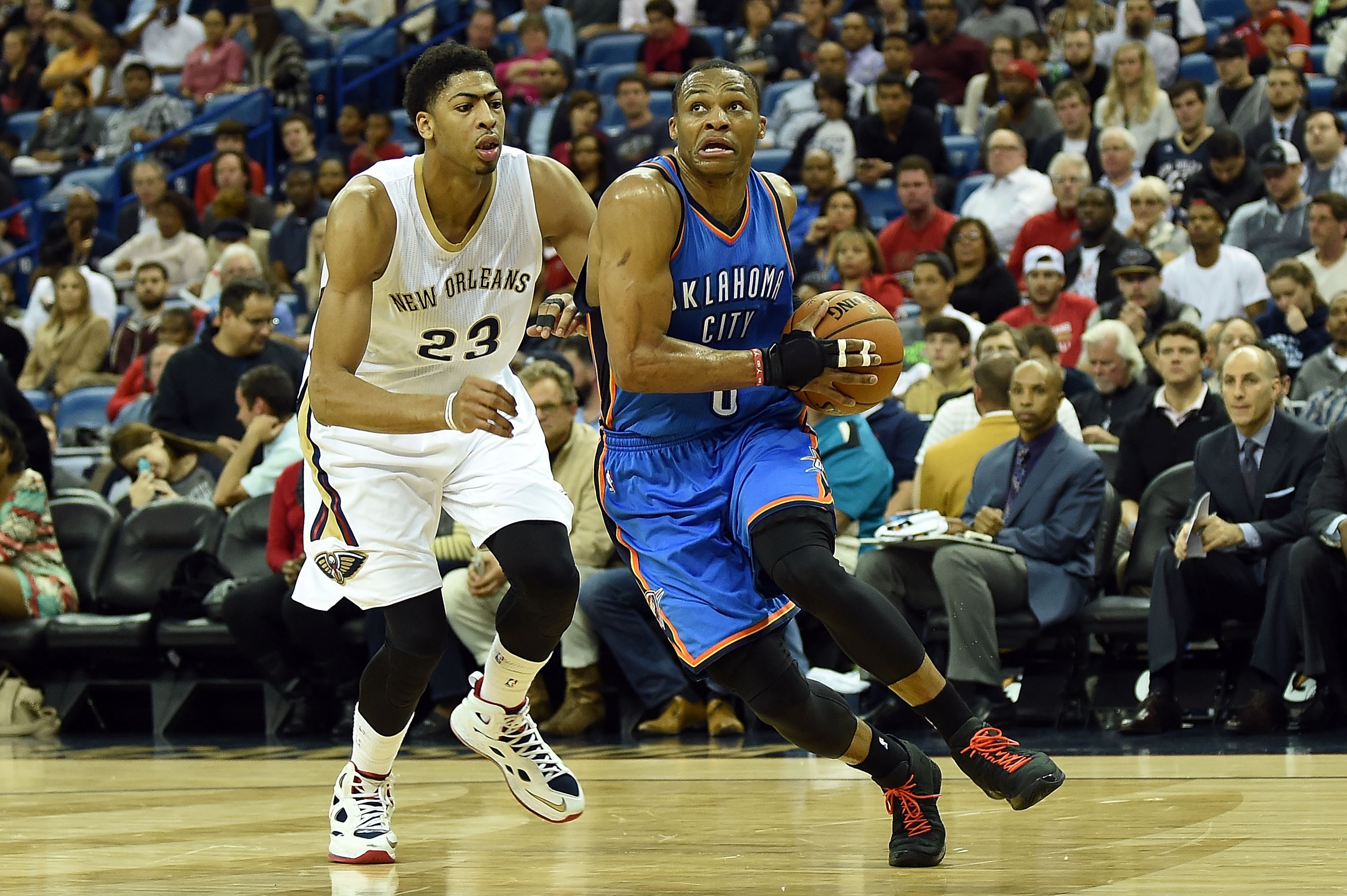 NEW ORLEANS, LA - DECEMBER 02: Russell Westbrook #0 of the Oklahoma City Thunder drives around Anthony Davis #23 of the New Orleans Pelicans during the second quarter of a game at the Smoothie King Center on December 2, 2014 in New Orleans, Louisiana. New Orleans won the game 112-104. NOTE TO USER: User expressly acknowlesges and agrees that by downloading and or using this photograph, User is consenting to the terms and conditions of the Getty Images License Agreement. (Photo by Stacy Revere/Getty Images)