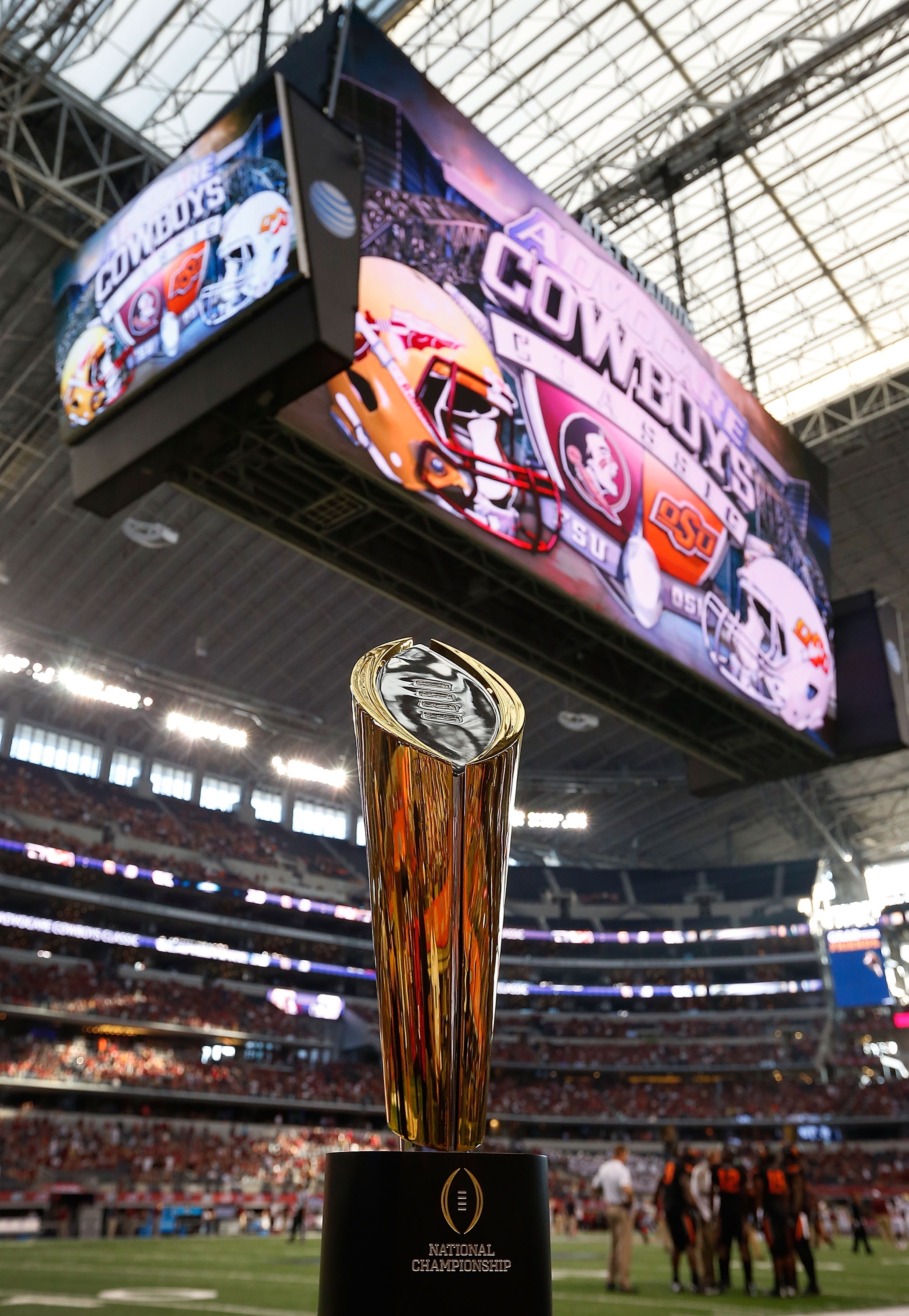 ARLINGTON, TX - AUGUST 30: The NCAA National Championship trophy is on display before the start of the game between the Oklahoma State Cowboys and the Florida State Seminoles in the Advocare Cowboys Classic at AT&T Stadium on August 30, 2014 in Arlington, Texas. (Photo by Tom Pennington/Getty Images)