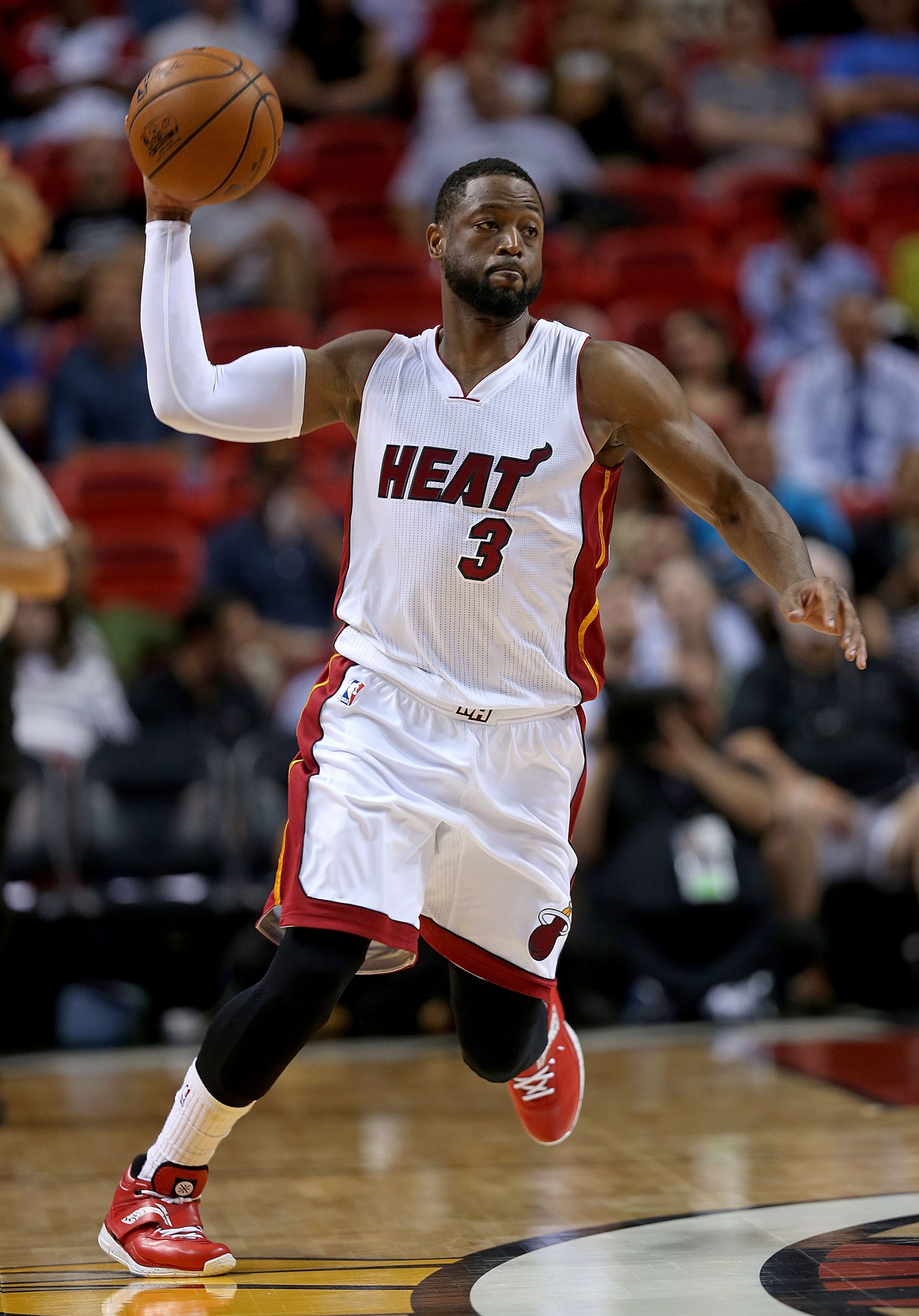MIAMI, FL - APRIL 13: Dwyane Wade #3 of the Miami Heat passes during a game against the Orlando Magic at American Airlines Arena on April 13, 2015 in Miami, Florida. NOTE TO USER: User expressly acknowledges and agrees that, by downloading and/or using this photograph, user is consenting to the terms and conditions of the Getty Images License Agreement. Mandatory copyright notice: (Photo by Mike Ehrmann/Getty Images)