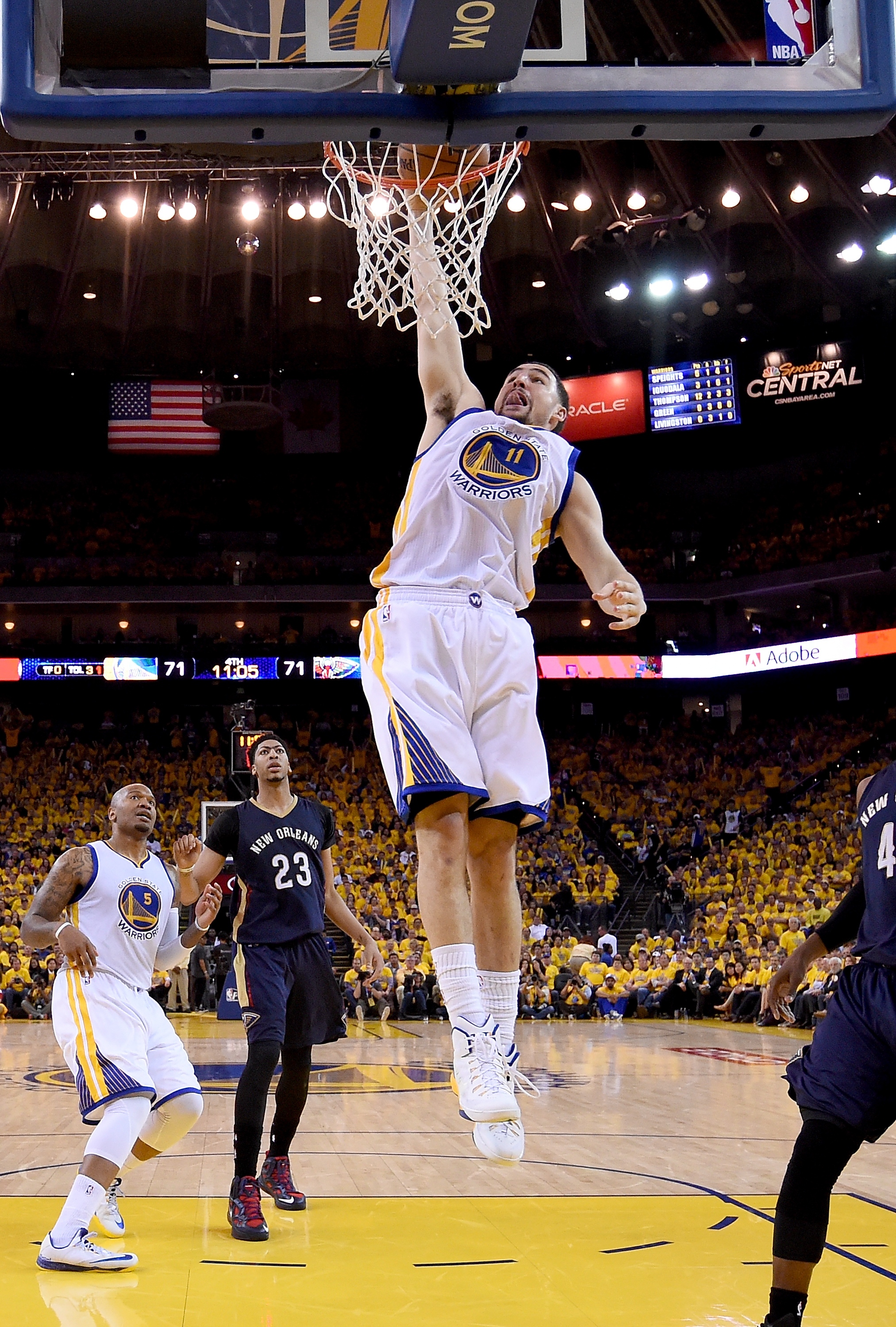 OAKLAND, CA - APRIL 20: Klay Thompson #11 of the Golden State Warriors slam dunks the ball against the New Orleans Pelicans in the third quarter during the first round of the 2015 NBA Playoffs at ORACLE Arena on April 20, 2015 in Oakland, California. NOTE TO USER: User expressly acknowledges and agrees that, by downloading and or using this photograph, User is consenting to the terms and conditions of the Getty Images License Agreement. (Photo by Thearon W. Henderson/Getty Images)