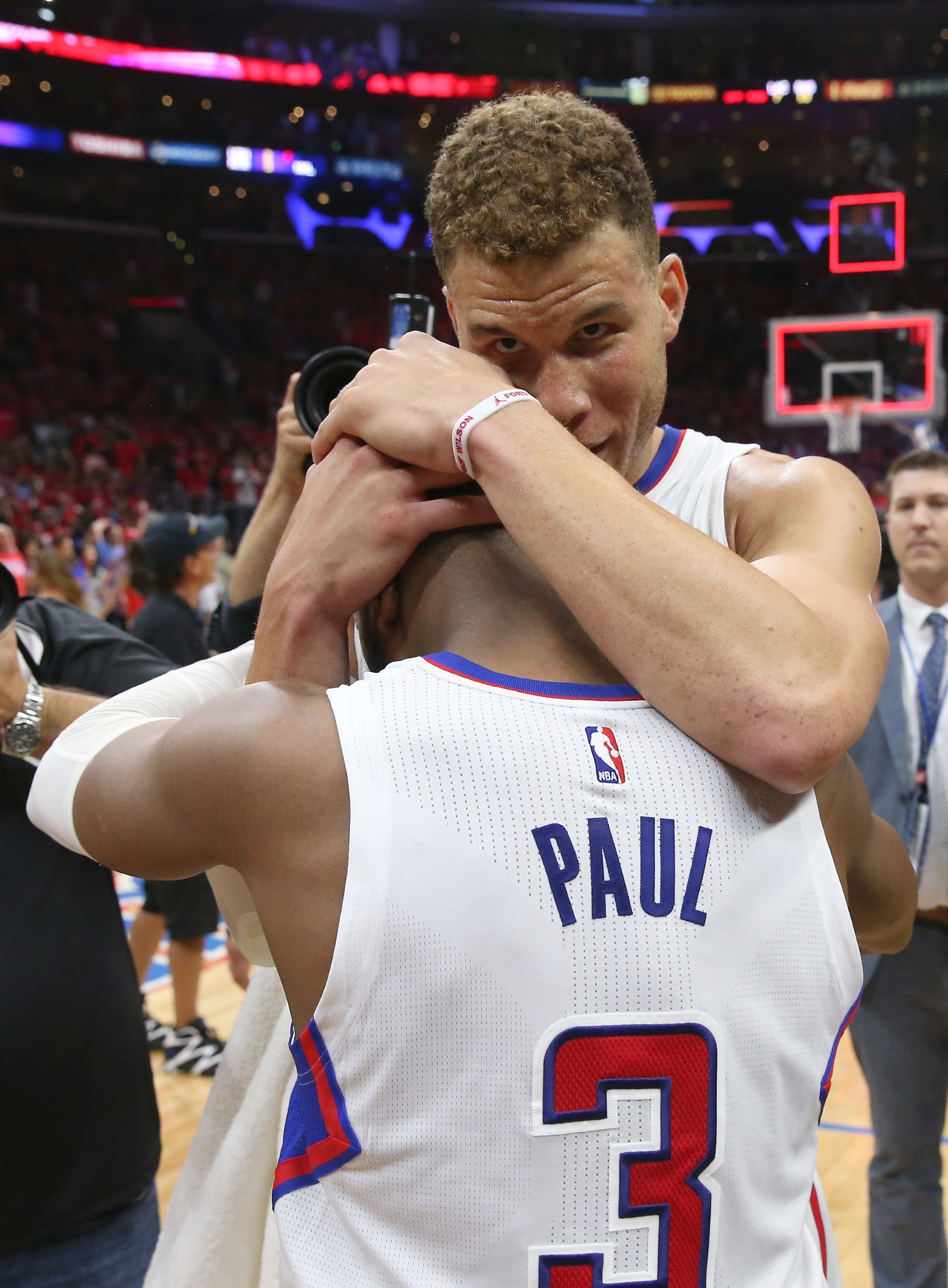 Blake Griffin and Chris Paul embrace. (Stephen Dunn/Getty Images)